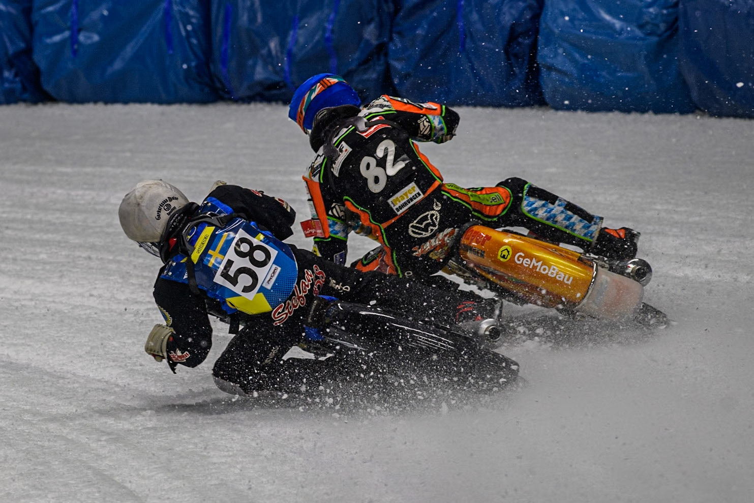 Sweden's Stefan Svensson (58) (White) inside Germany's Markus Jell (82) (Blue) during the FIM Ice Speedway Gladiators World Championship Final 1 at the Max-Aicher-Arena, Inzell on Saturday 23 March 2024. (Photo: Ian Charles | MI News)