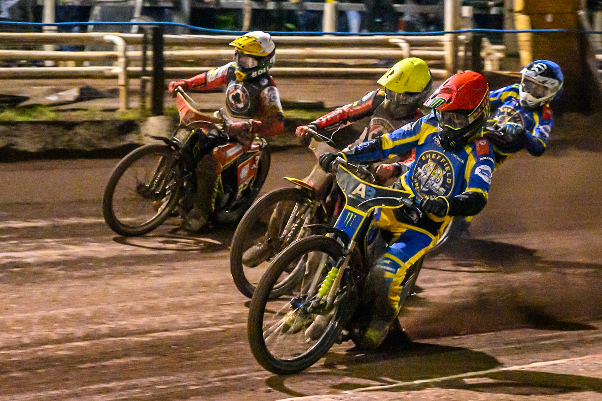 Chris Holder of Sheffield Tigers in Red on the inside of Tate Zischke of Belle Vue Aces in Yellow and Mitch McDiarmid, Guest rider for Belle Vue Aces in White  with Jye Etheridge of Sheffield Tigers in Blue  behind during the Rowe Motor Oil Premiership Grand Final 1st Leg match between Sheffield Tigers and Belle Vue Aces at Owlerton Stadium, Sheffield on Monday 12th October 2026. (Photo: Ian Charles | MI News)