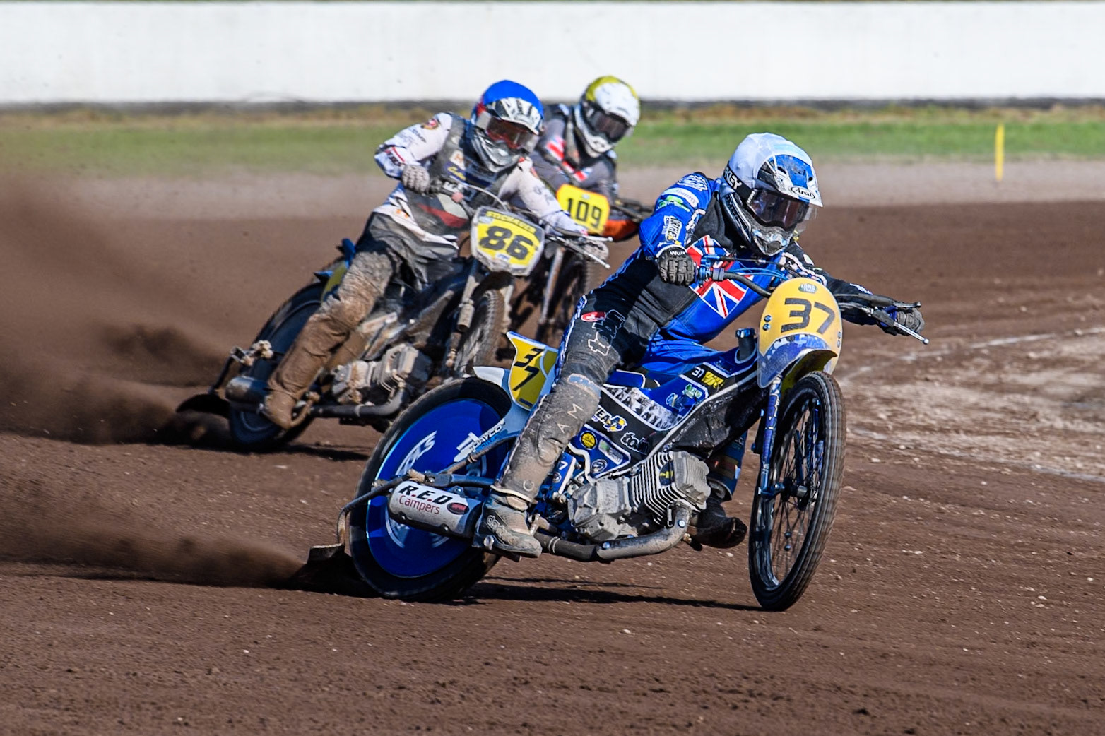 Chris Harris (37)of Great Britain in White leading Hynek Stichauer (86) of Czech Republic  in Blue and Zach Wajtknecht (109) of Great Britain in Yellow during the FIM Long Track World Championship Final 5 at the Speed Centre Roden, Roden, Netherlands on Sunday 22nd September 2024. (Photo: Ian Charles | MI News)