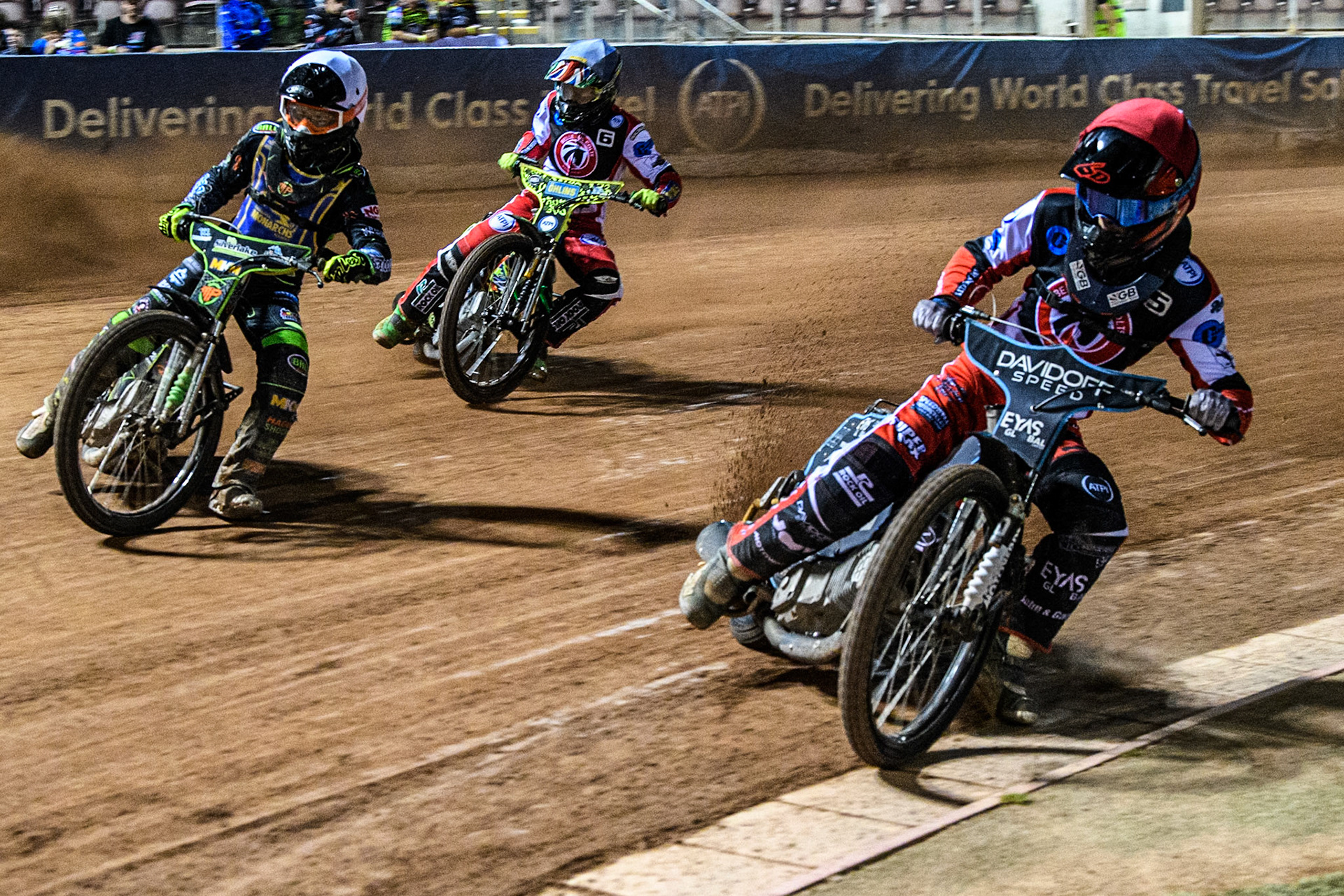 Belle Vue Colts' Freddy Hodder in Red rides inside Edinburgh Monarchs' Max Perry in White with Belle Vue Colts' William Cairns behind during the WSRA National Development League match between Belle Vue Aces and Edinburgh Monarchs at the National Speedway Stadium, Manchester on Friday 30th August 2024. (Photo: Ian Charles | MI News)