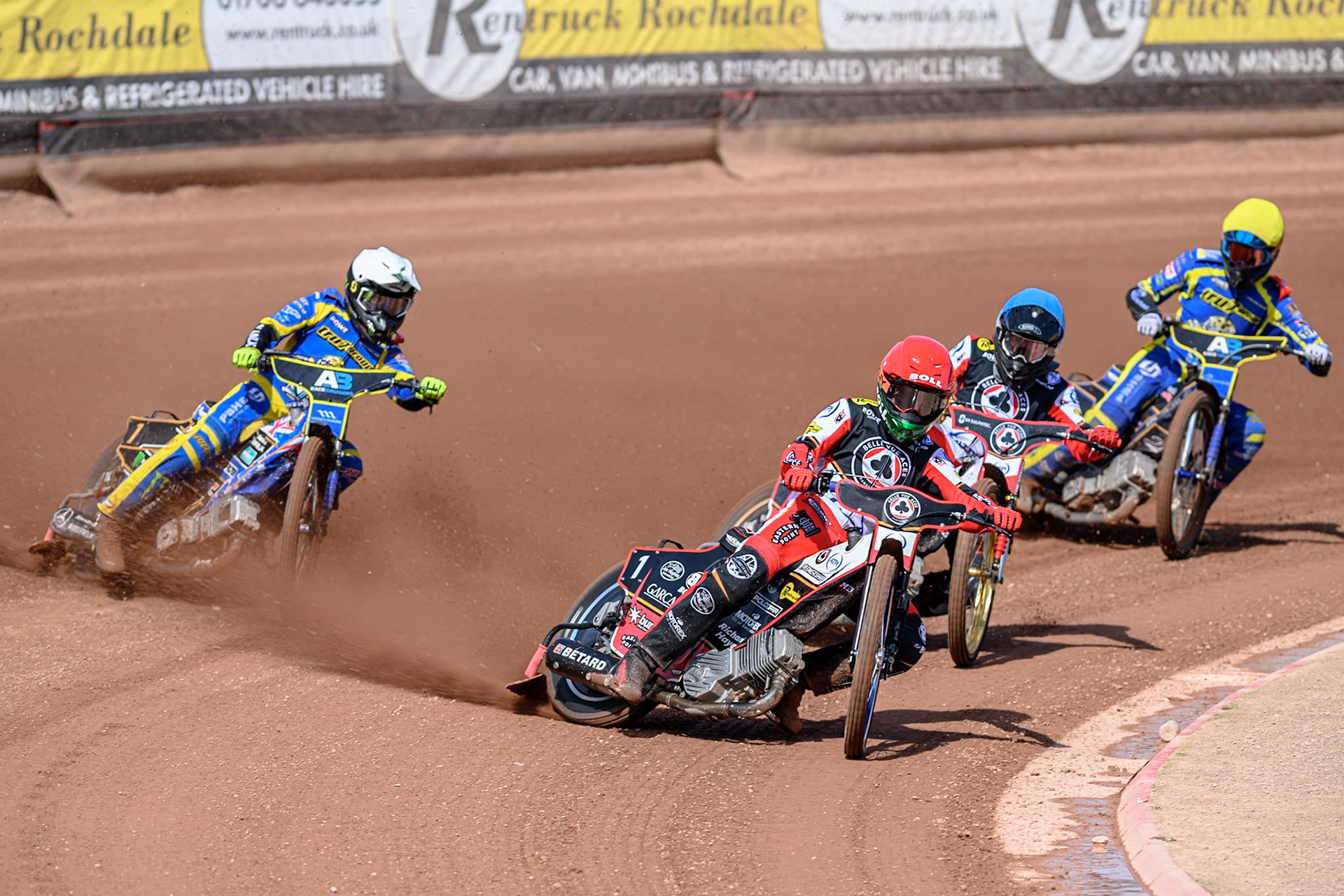 Brady Kurtz of Belle Vue Aces  in Red leading Norick Blödorn of Belle Vue Aces  in Blue, Jack Holder of Sheffield Tigers  in White and Anders Rowe of Sheffield Tigers  in Yellow during the Rowe Motor Oil Premiership match between Belle Vue Aces and Sheffield Tigers at the National Speedway Stadium, Manchester on Monday 25th August 2025. (Photo: Ian Charles | MI News)