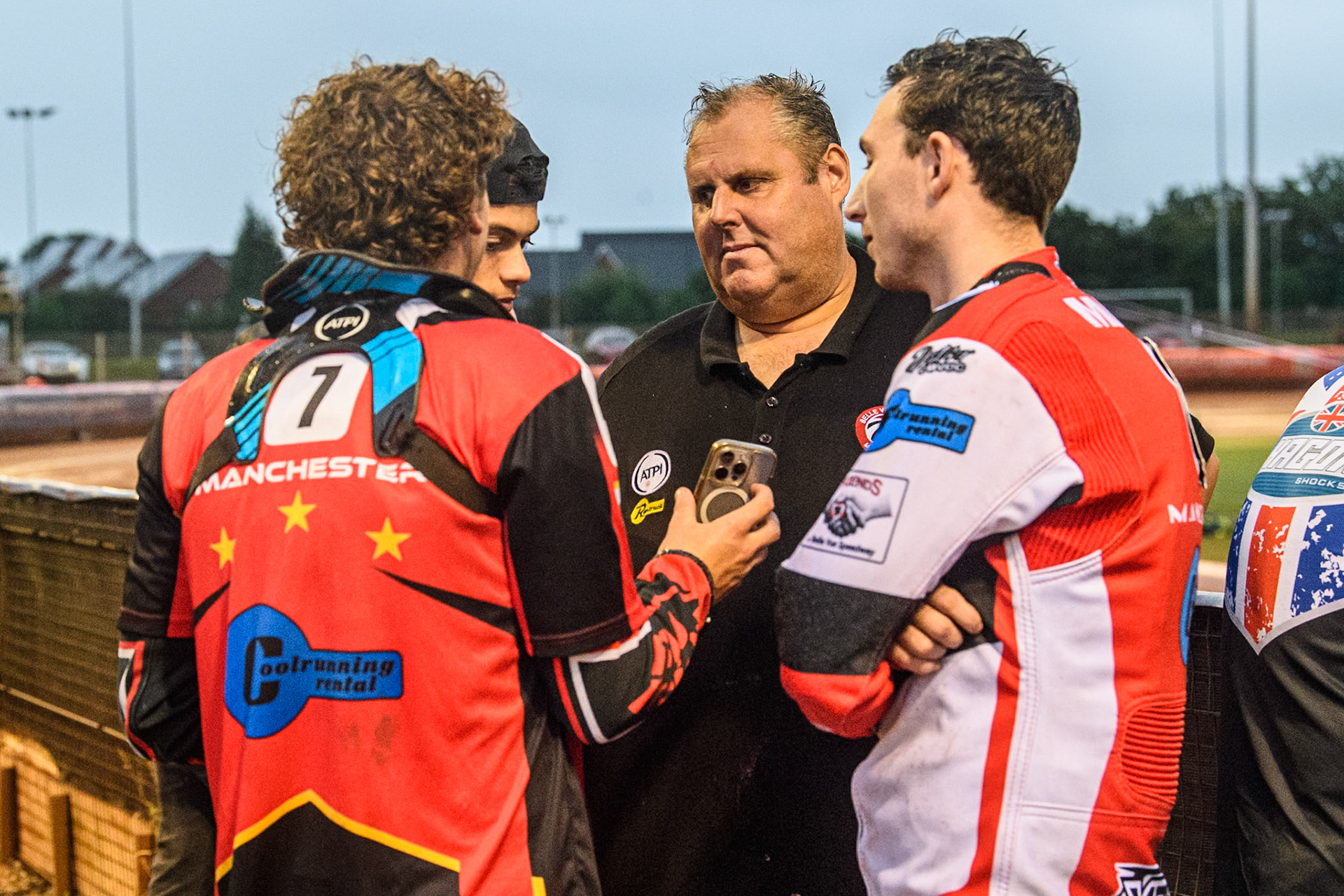 Belle Vue riders with Belle Vue Colts' Joint Team Manager Steve Williams discuss the track work during the WSRA National Development League match between Belle Vue Colts and Oxford Chargers at the National Speedway Stadium, Manchester on Friday 2nd August 2024. (Photo: Ian Charles | MI News)