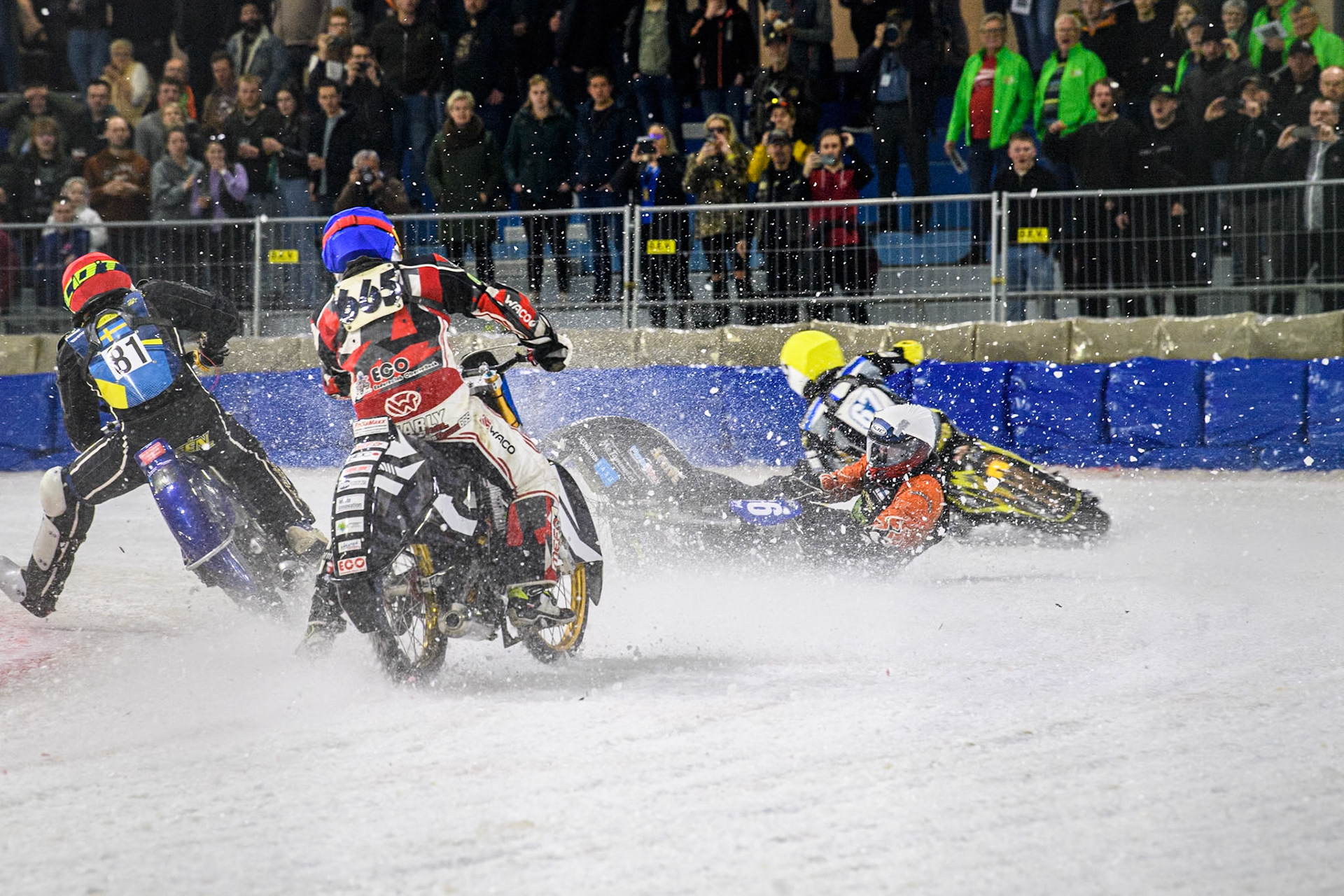 Finland's Aki Ala-Riihimäki (66) in White spins off leaving Austria's Charly Ebner (665) in Blue with nowhere to go during the FIM Ice Speedway Gladiators World Championship Final 4 at Ice Rink Thialf, Heerenveen on Sunday 7th April 2024. (Photo: Ian Charles | MI News)