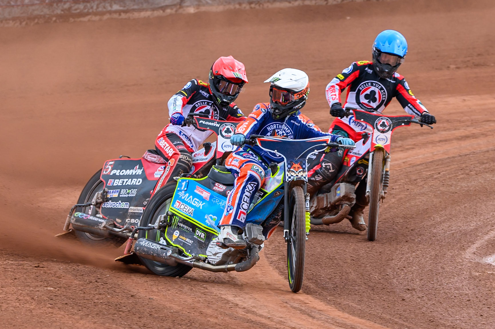Jaimon Lidsey of Northampton Foxes in White leading Dan Bewley of Belle Vue Aces in Red and Tate Zischke of Belle Vue Aces in Blue during the Rowe Motor Oil Premiership match between Belle Vue Aces and Northampton Foxes at the National Speedway Stadium, Manchester on Monday 4th May 2026. (Photo: Ian Charles | MI News)