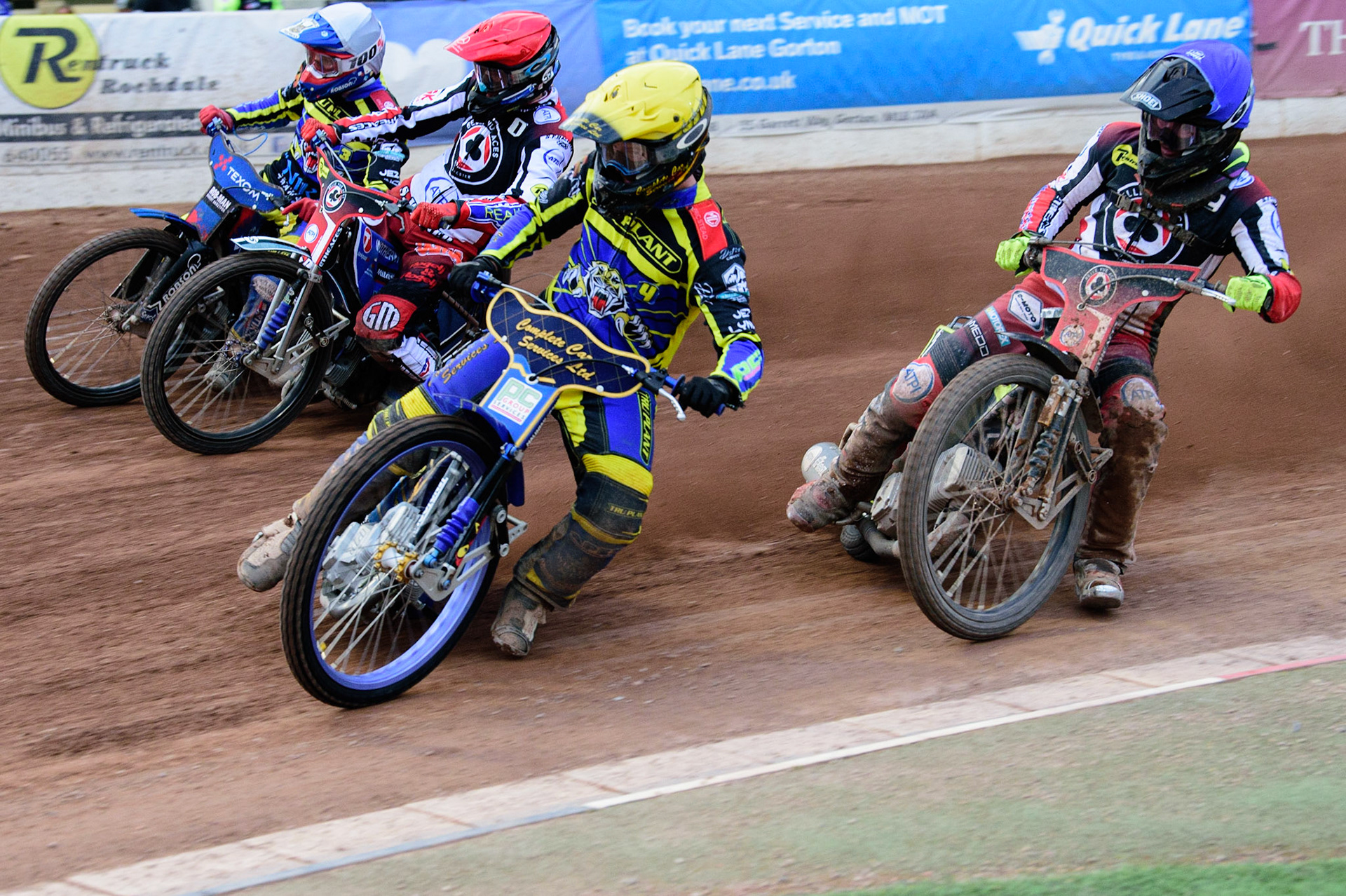 MANCHESTER, UK. JUL 5TH  Kyle Howarth  (Yellow) leads Matej Zagar  (Red) Tobiasz Musielak  (White) with Tom Brennan  (Blue) behind  during the SGB Premiership match between Belle Vue Aces and Sheffield Tigers at the National Speedway Stadium, Manchester on Tuesday 5th July 2022. (Credit: Ian Charles | MI News)