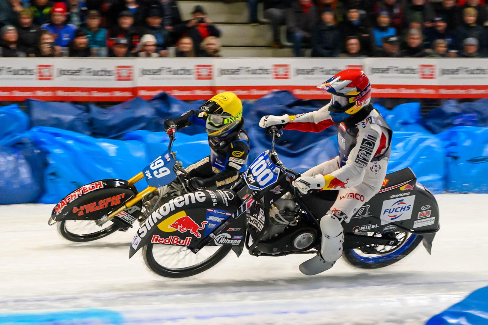 Franz Zorn (100) of Austria in Red rides inside Martin Haarahiltunen (199) of Sweden in Yellow behind during the Ice Speedway Gladiators World Championship Final 2 at Max-Aicher-Arena, Inzell on Sunday 15th March 2026. (Photo: Ian Charles | MI News)
