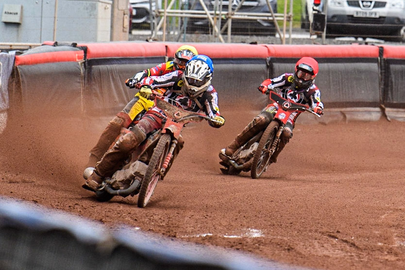 Connor Bailey (Blue) leads  Drew Kemp (Yellow) and Tom Brennan (Red) during the Sports Insure Premiership match between Belle Vue Aces and Leicester Lions at the National Speedway Stadium, Manchester on Monday 28th August 2023. (Photo: Ian Charles | MI News)