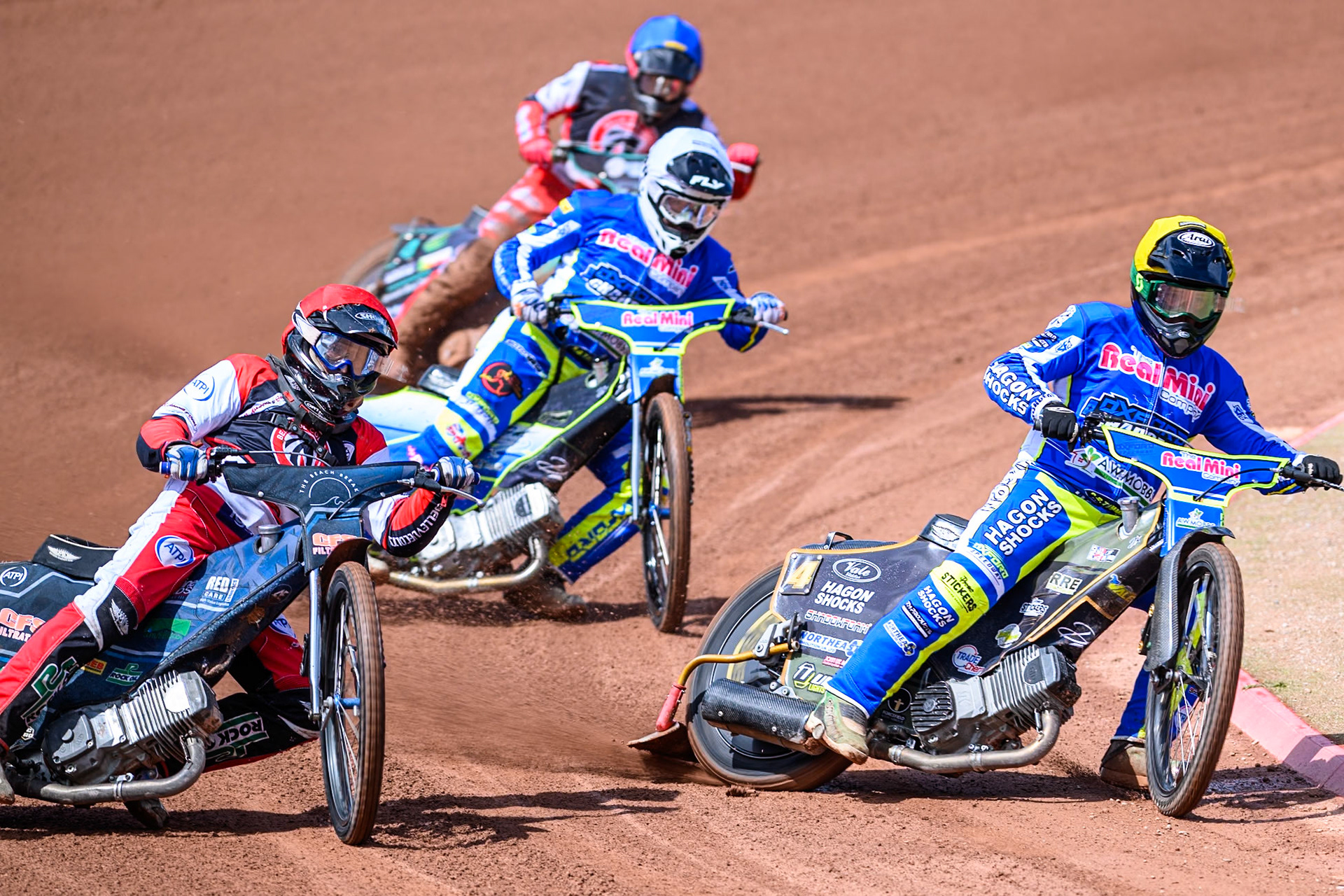 Oxford Chargers' Ashton Vale in Yellow rides inside Belle Vue Colts' Jack Kingston  in Red with Oxford Chargers' Arran Butcher  in White and Belle Vue Colts' Mason Watson  in Blue behind during the WSRA National Development League match between Belle Vue Colts and Oxford Chargers at the National Speedway Stadium, Manchester on Sunday 1st June 2025. (Photo: Ian Charles | MI News)