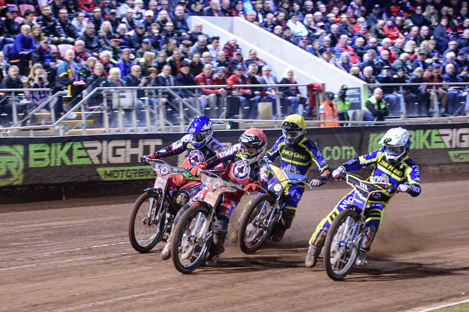 MANCHESTER, UK. OCT 7TH  The final heat as Dan Bewley  (Red) and Richie Worrall  (Blue) leads Jack Holder  (White) and Adam Ellis  (Yellow) during the SGB Premiership Play off Semi-Final Second Leg between Belle Vue Aces and Sheffield Tigers at the National Speedway Stadium, Manchester on Thursday 7th October 2021. (Credit: Ian Charles | MI News)
