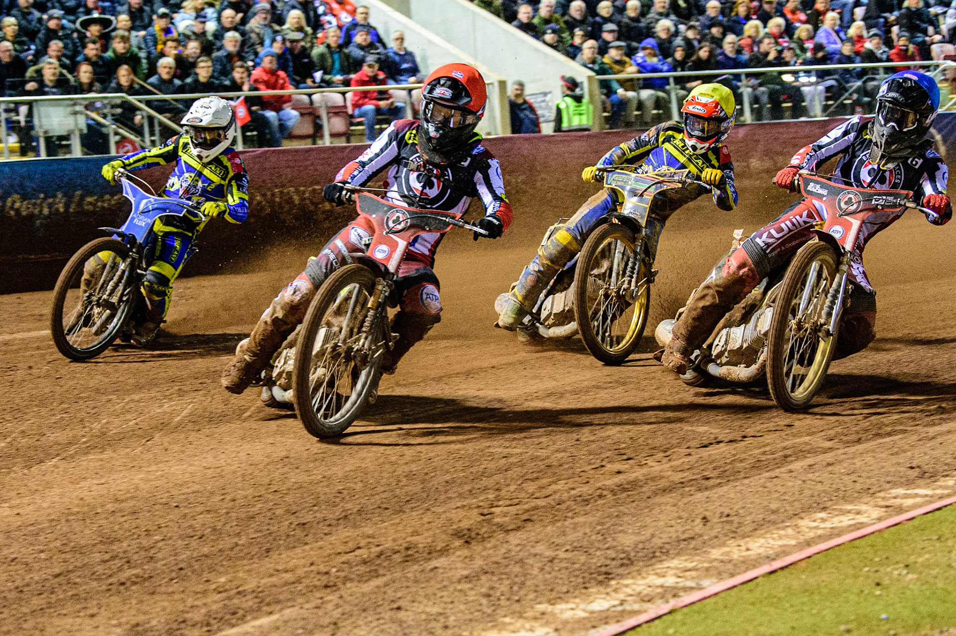 Tom Brennan  (Red) leads Norick Blödorn  (Blue), Connor Mountain  (Yellow) and Lewis Kerr  (White) during the SGB Premiership Grand Final 1st leg between Belle Vue Aces and Sheffield Tigers at the National Speedway Stadium, Manchester on Monday 10th October 2022. (Credit: Ian Charles | MI News)