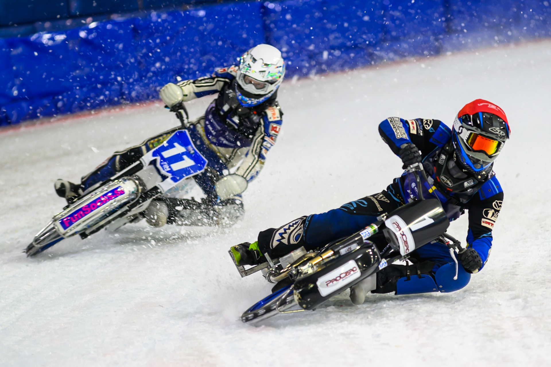 Niclas Svensson (1) of Sweden  in Red passes Max Koivula (11) of Finland  in White during the FIM Ice Speedway Of Nations at Ice Rink Thialf, Heerenveen on Sunday 12th April 2026. (Photo: Ian Charles | MI News)