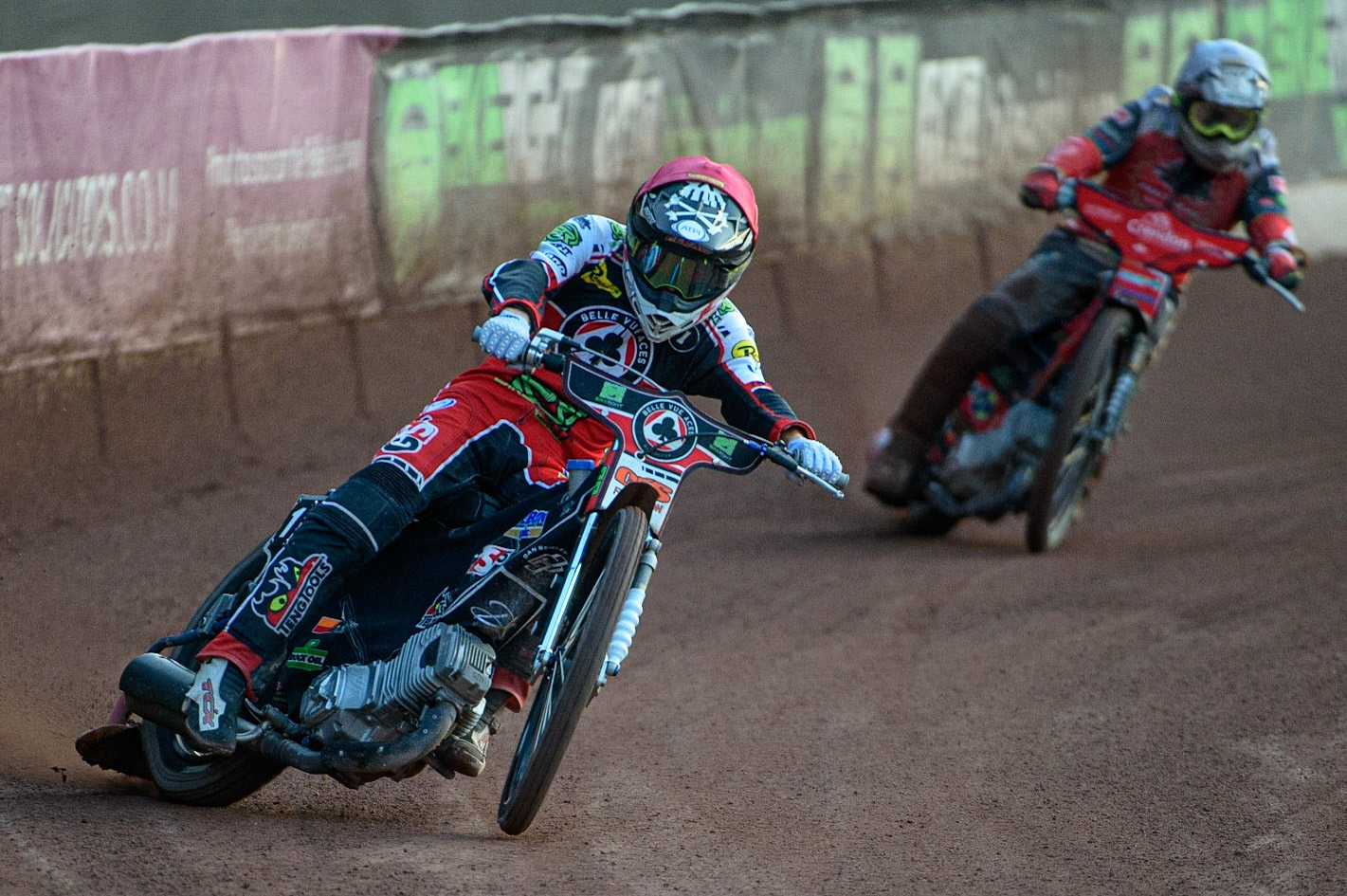 MANCHESTER, UK. AUG 9TH  Dan Bewley  (Red) leads Chris Harris  (White) during the SGB Premiership match between Belle Vue Aces and Peterborough at the National Speedway Stadium, Manchester on Monday 9th August 2021. (Credit: Ian Charles | MI News)