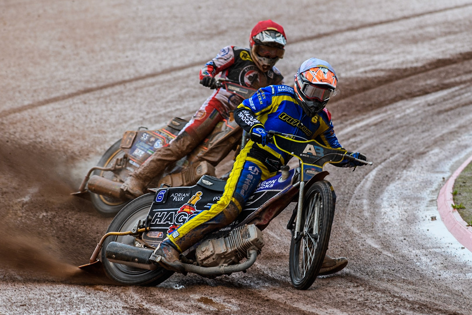 Sheffield Tigers' Jason Edwards in White leading Belle Vue Aces' Connor Mountain in Red during the Rowe Motor Oil Premiership match between Belle Vue Aces and Sheffield Tigers at the National Speedway Stadium, Manchester on Monday 27th May 2024. (Photo: Ian Charles | MI News)