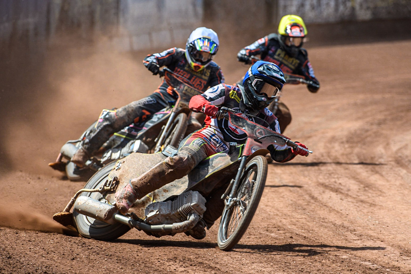 Tom Brennan (Blue) leads  Leon Flint (White) and Zach Cook (Yellow) during the Sports Insure Premiership match between Belle Vue Aces and Wolverhampton Wolves at the National Speedway Stadium, Manchester on Monday 29th May 2023. (Photo: Ian Charles | MI News)