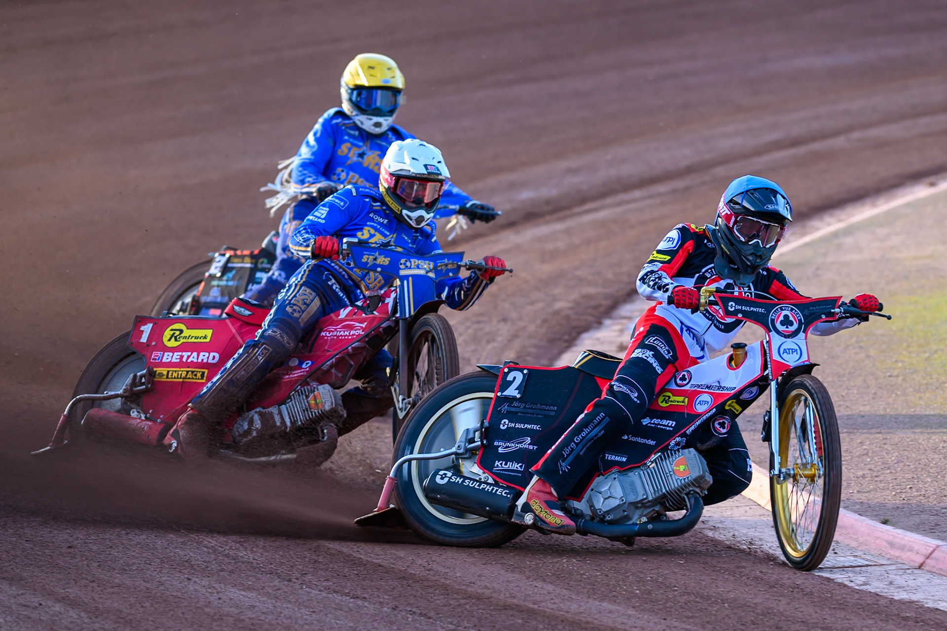 Norick Blödorn of Belle Vue Aces in Blue leading Max Fricke of Kings Lynn Stars in White and Cooper Rushen of Kings Lynn Stars in Yellow during the Rowe Motor Oil Premiership match between Belle Vue Aces and King's Lynn Stars at the National Speedway Stadium, Manchester on Monday 10th August 2026. (Photo: Ian Charles | MI News)