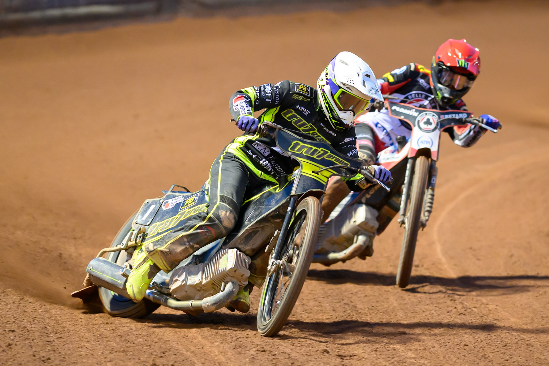 Tom Brennan of Ipswich Witches  in White leading Dan Bewley of Belle Vue Aces  in Red during the Rowe Motor Oil Premiership match between Belle Vue Aces and Ipswich Witches at the National Speedway Stadium, Manchester on Monday 20th April 2026. (Photo: Ian Charles | MI News)