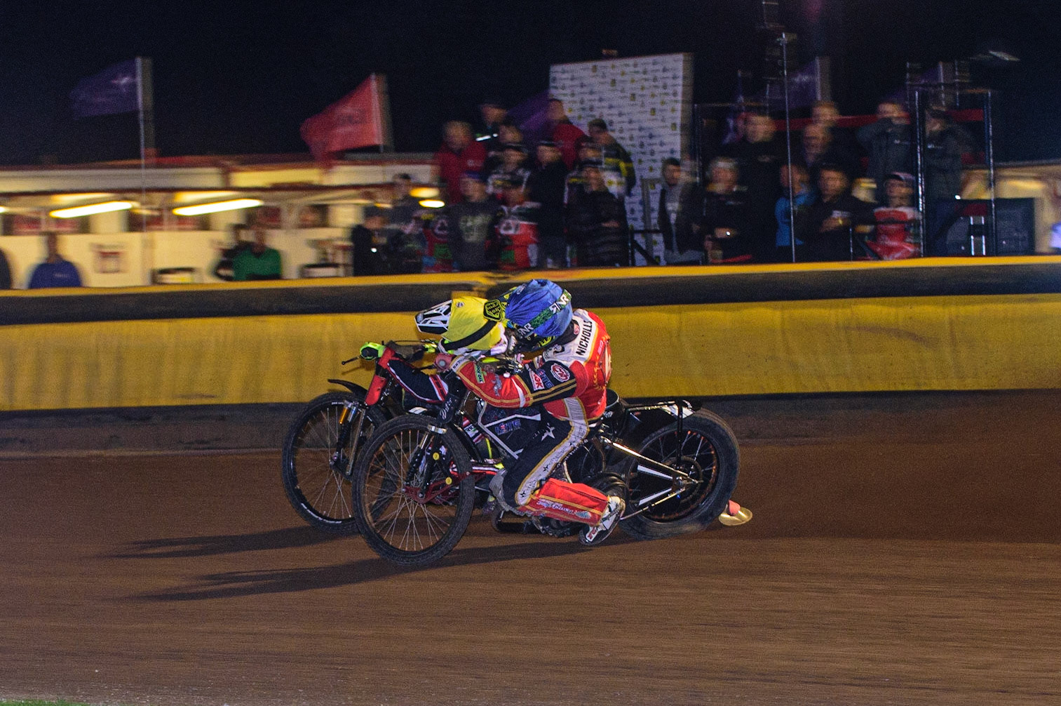 PETERBOROUGH, UK. OCT 14TH Tom Brennan (Yellow) outside Chris Harris  (Blue) during the SGB Premiership Grand Final 2nd leg between Peterborough and Belle Vue Aces at East of England Showground, Peterborough on Thursday 14th October 2021. (Credit: Ian Charles | MI News)