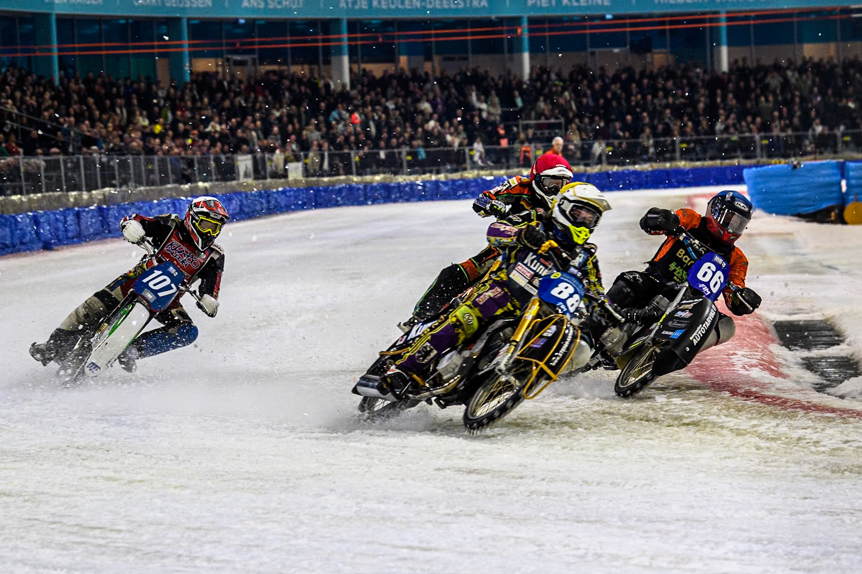 Germany's Max Niedermaier (88) in Yellow leading Finland's Aki Ala-Riihimäki (66) in Blue Germany's Markus Jell (82) in Red and Czech Republic's Andrej Diviš (107) in White during the FIM Ice Speedway Gladiators World Championship Final 3 at Ice Rink Thialf, Heerenveen on Saturday 6th April 2024. (Photo: Ian Charles | MI News)