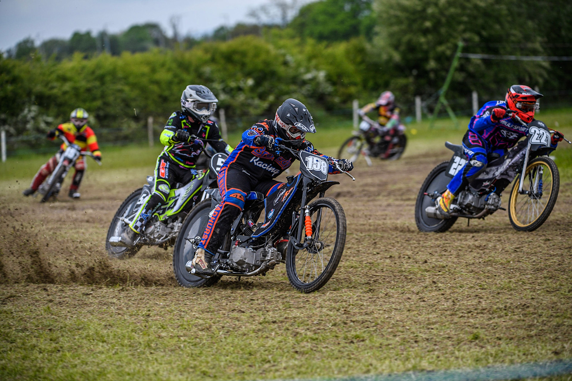 Wayne Broadhurst (158) outside Luke Wicks (227) with Ian Clarke (54) all battling for the lead in the GT140 Class during the Cheshire Grass Track Three Trophies meeting at High Legh, Cheshire on Sunday 14th May 2023. (Photo: Ian Charles | MI News)