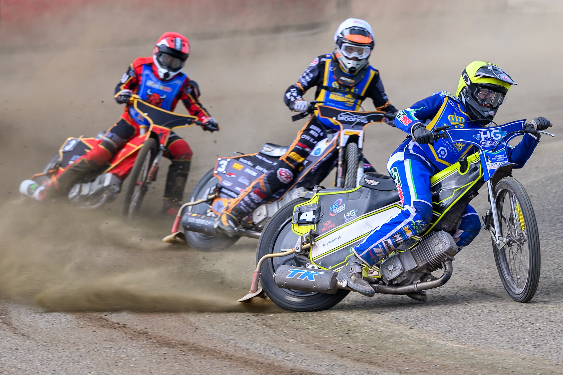 Vinnie Foord of Edinburgh Monarchs Academy in Yellow leading Ryan Ingram, Guest Rider for Edinburgh Monarchs Academy in White and Luke Harris of Buxton Bulls in Red during the WSRA National Development League match between Buxton Bulls and Edinburgh Monarchs Academy at Hi-Edge Speedway, Buxton on Sunday 14th June 2026. (Photo: Ian Charles | MI News)
