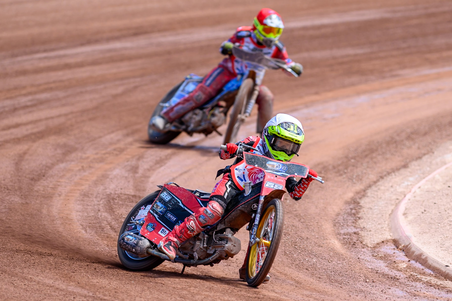 BRITISH YOUTH CHAMPIONSHIP 125cc Oscar Berwick (68) in White leading Ella Marshall (12)  in Red during the British Youth Championship (125cc) at the National Speedway Stadium, Manchester on Sunday 19th July 2026. (Photo: Ian Charles | MI News)