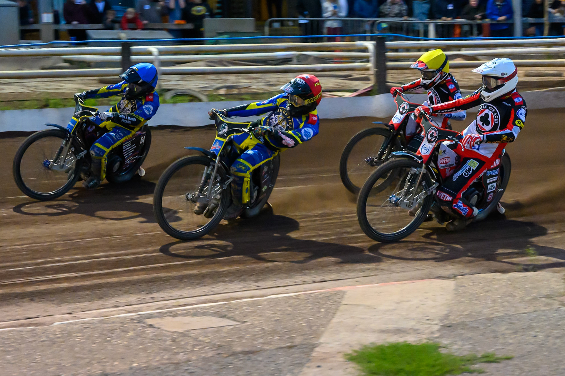 Josh Pickering of Sheffield Tigers in Red  and Luke Killeen of Sheffield Tigers in Blue leading Peter Kildemand of Belle Vue Aces in White  and Zach Cook of Belle Vue Aces in Yellow  during the Rowe Motor Oil Premiership match between Sheffield Tigers and Belle Vue Aces at Owlerton Stadium, Sheffield on Monday 31st August 2026. (Photo: Ian Charles | MI News)