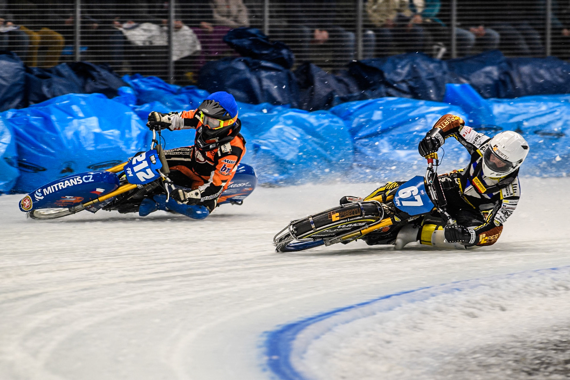 Heikki Huusko (67) of Finland in White rides inside Lukas Hutla (212) of the Czech Republic in Blue during the Ice Speedway Gladiators World Championship Final 2 at Max-Aicher-Arena, Inzell on Sunday 16th March 2025. (Photo: Ian Charles | MI News)