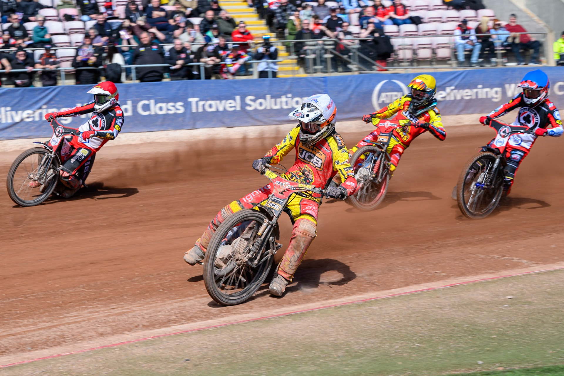 Sam Masters of Leicester Lions  in White leading Peter Kildemand of Belle Vue Aces  in Red, Drew Kemp of Leicester Lions  in Yellow and Zach Cook of Belle Vue Aces  in Blue during the Knockout Cup Northern Section match between Belle Vue Aces and Leicester Lions at the National Speedway Stadium, Manchester on Monday 6th April 2026. (Photo: Ian Charles | MI News)