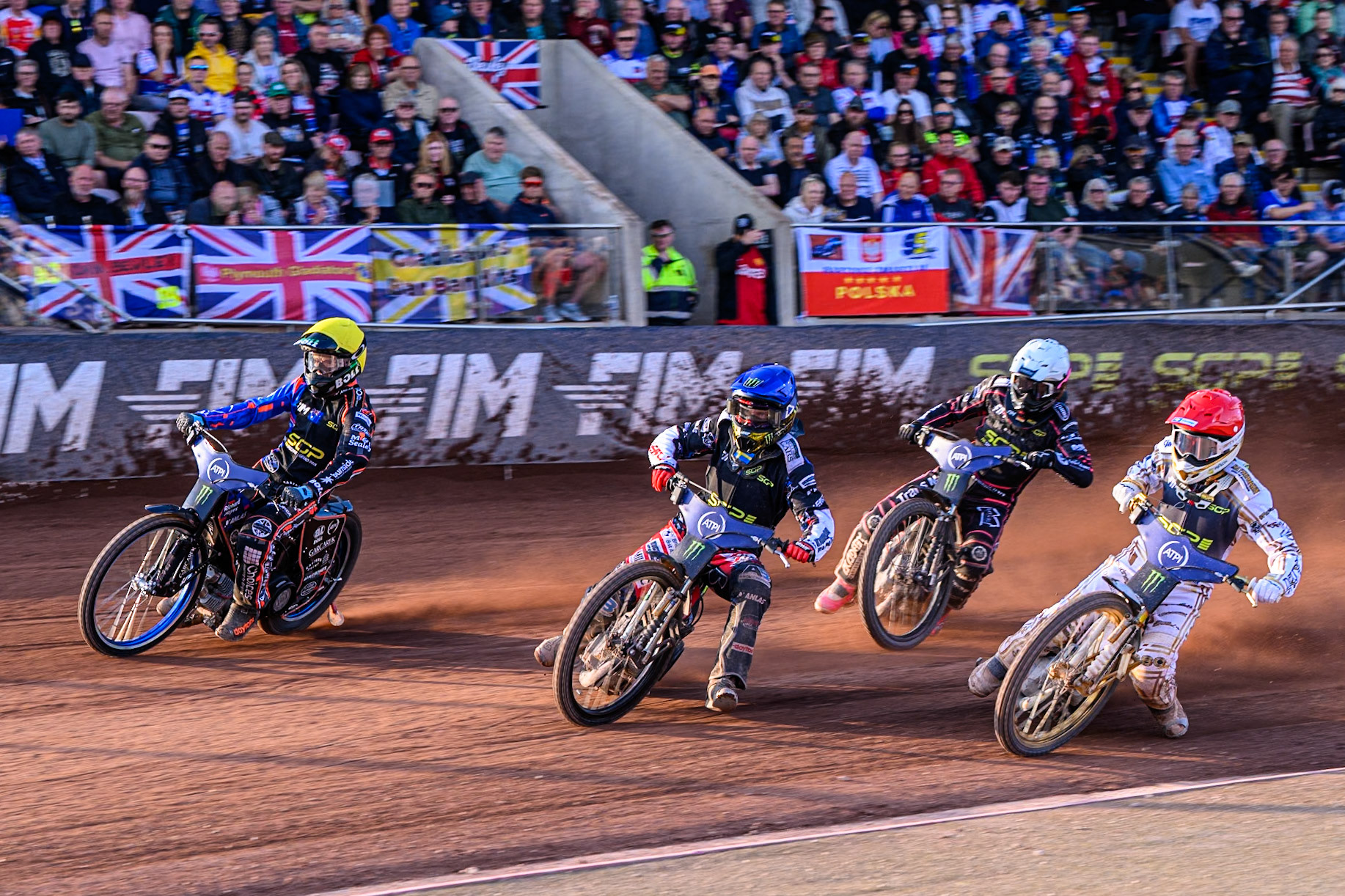 Brady Kurtz (101) of Australia on the outside of Fredrik Lindgren (66) of Sweden in Blue and Anders Thomsen (105) of Denmark in Red with Kai Huckenbeck (744) of Germany in White behind during the ATPI FIM Speedway Grand Prix Round 5 at the National Speedway Stadium, Manchester, on Saturday 14th June 2025. (Photo: Ian Charles | MI News)