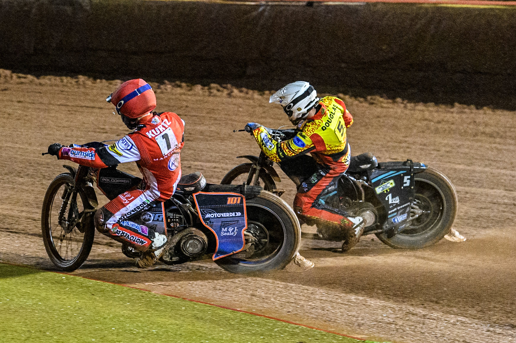 Belle Vue Aces' Brady Kurtz  in Red rides inside Leicester Lions' Ryan Douglas  in White during the Rowe Motor Oil Premiership Grand Final 1st Leg between Belle Vue Aces and Leicester Lions at the National Speedway Stadium, Manchester on Monday 23rd September 2024. (Photo: Ian Charles | MI News)