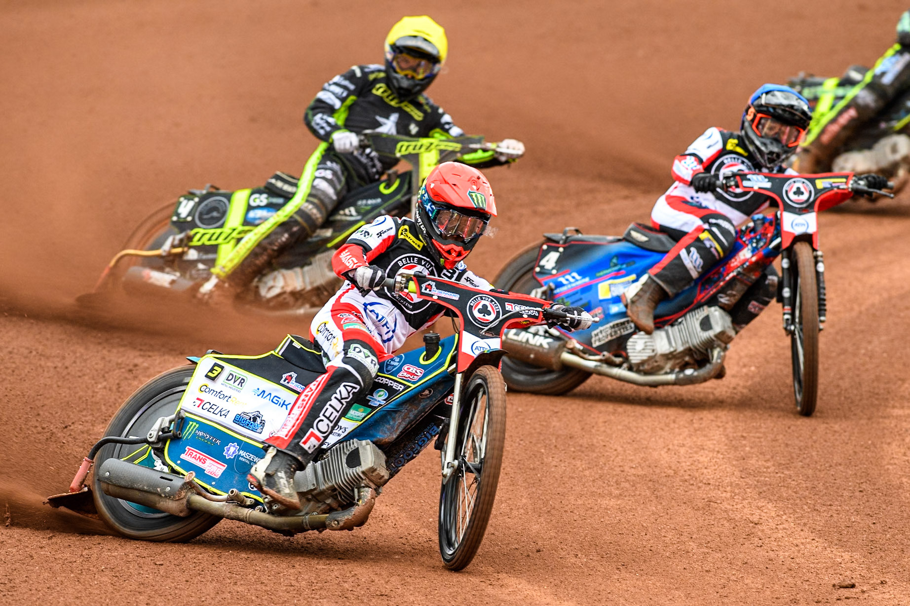 Belle Vue Aces' Jaimon Lidsey  in Red leading Belle Vue Aces' Ben Cook  in Blue and Ipswich Witches' Adam Ellis in Yellow during the Rowe Motor Oil Premiership match between Belle Vue Aces and Ipswich Witches at the National Speedway Stadium, Manchester on Monday 1st July 2024. (Photo: Ian Charles | MI News)