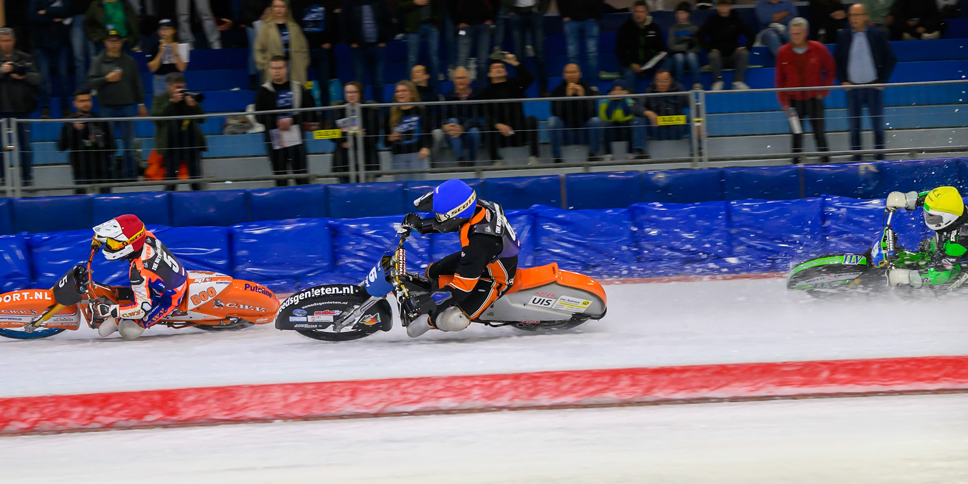 Jasper Iwema (5) of The Netherlands in Red leading Sebastian Reitsma (6) of The Netherlands  in Blue and Andrej Diviš (8) of Czechia  in Yellow during the FIM Ice Speedway Of Nations at Ice Rink Thialf, Heerenveen on Sunday 12th April 2026. (Photo: Ian Charles | MI News)
