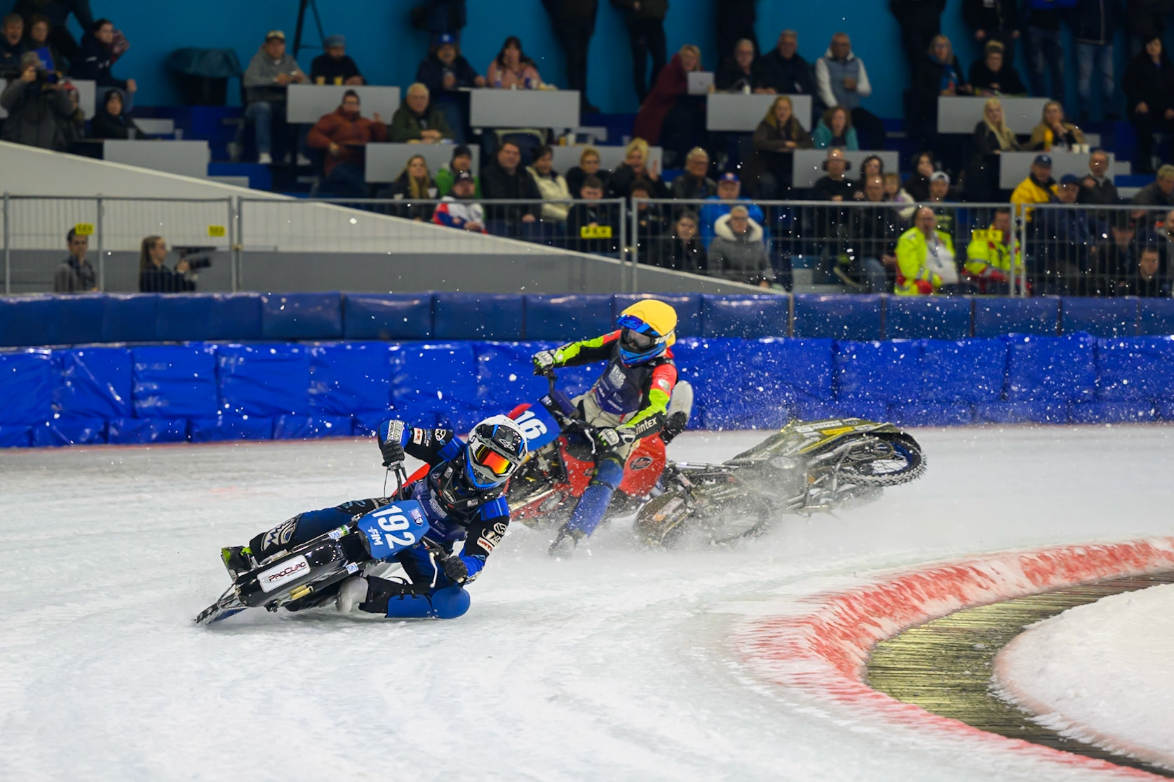Heikki Huusko (67) of Finland  collides with Wild Card Harald Simon (16) of Austria in Yellow in the first turn during the FIM Ice Speedway Gladiators World Championship Final 3 at Ice Rink Thialf, Heerenveen on Saturday 11th April 2026. (Photo: Ian Charles | MI News)
