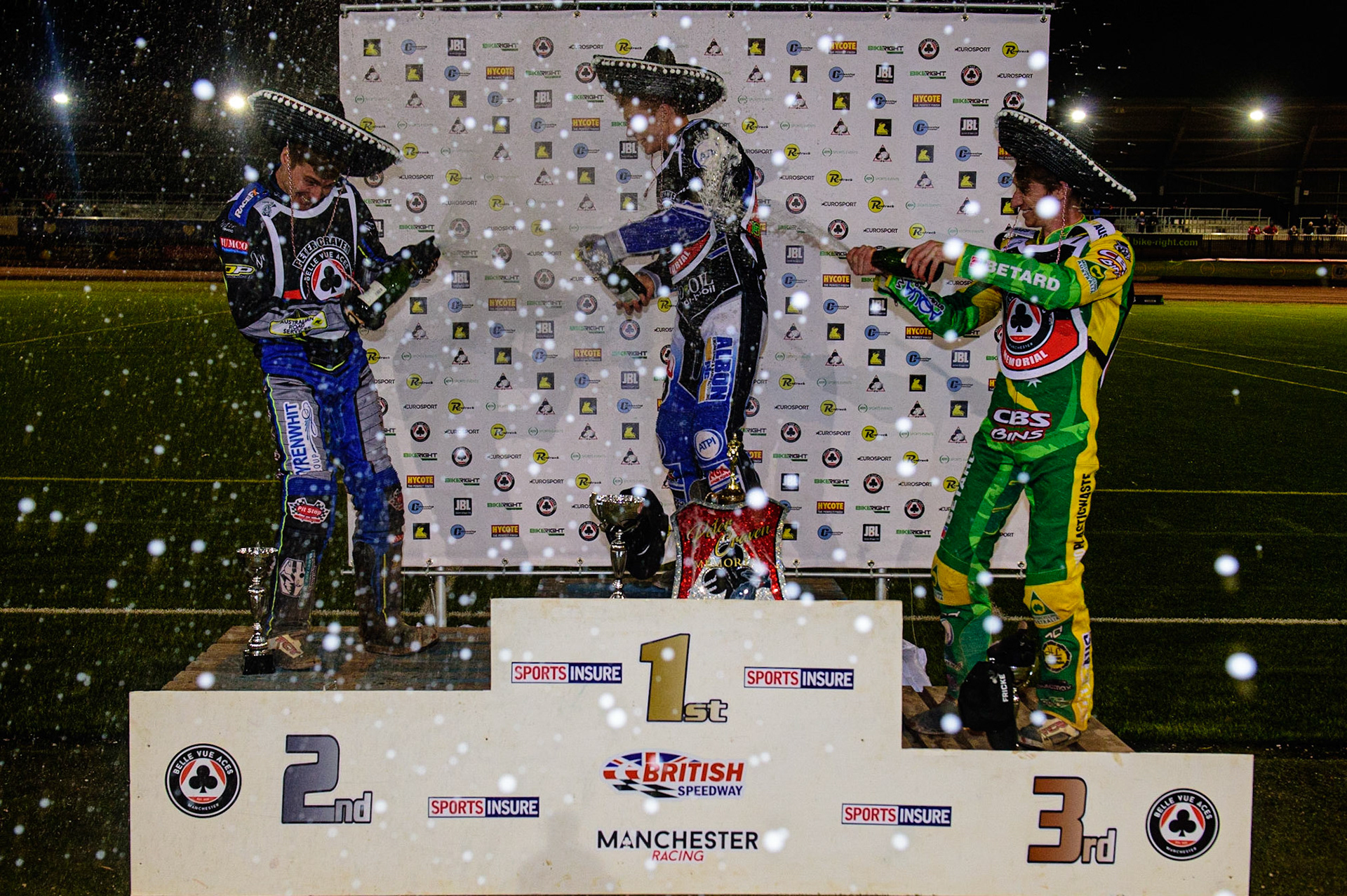 MANCHESTER, UK. OCT 23RD  Top three spray the champagne during the Peter Craven Memorial Trophy event at the National Speedway Stadium, Manchester on Saturday 23rd October 2021. (Credit: Ian Charles | MI News)