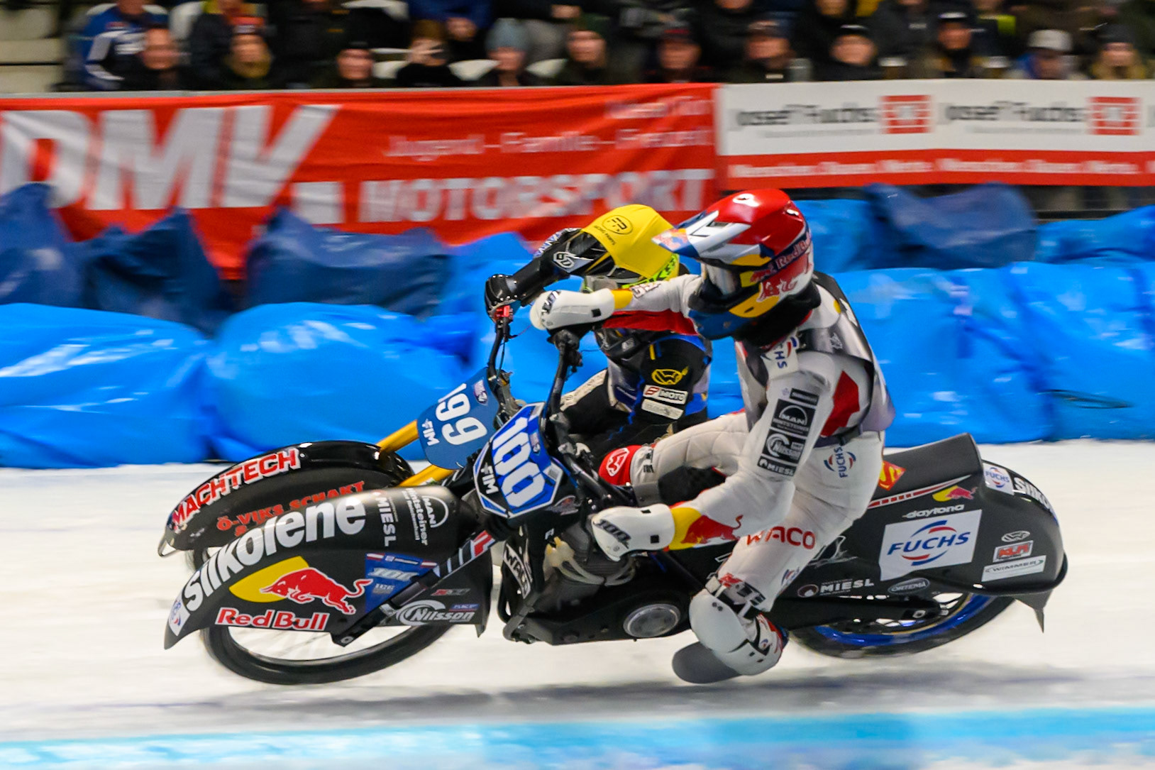 Franz Zorn (100) of Austria in Red rides inside Martin Haarahiltunen (199) of Sweden in Yellow behind during the Ice Speedway Gladiators World Championship Final 2 at Max-Aicher-Arena, Inzell on Sunday 15th March 2026. (Photo: Ian Charles | MI News)