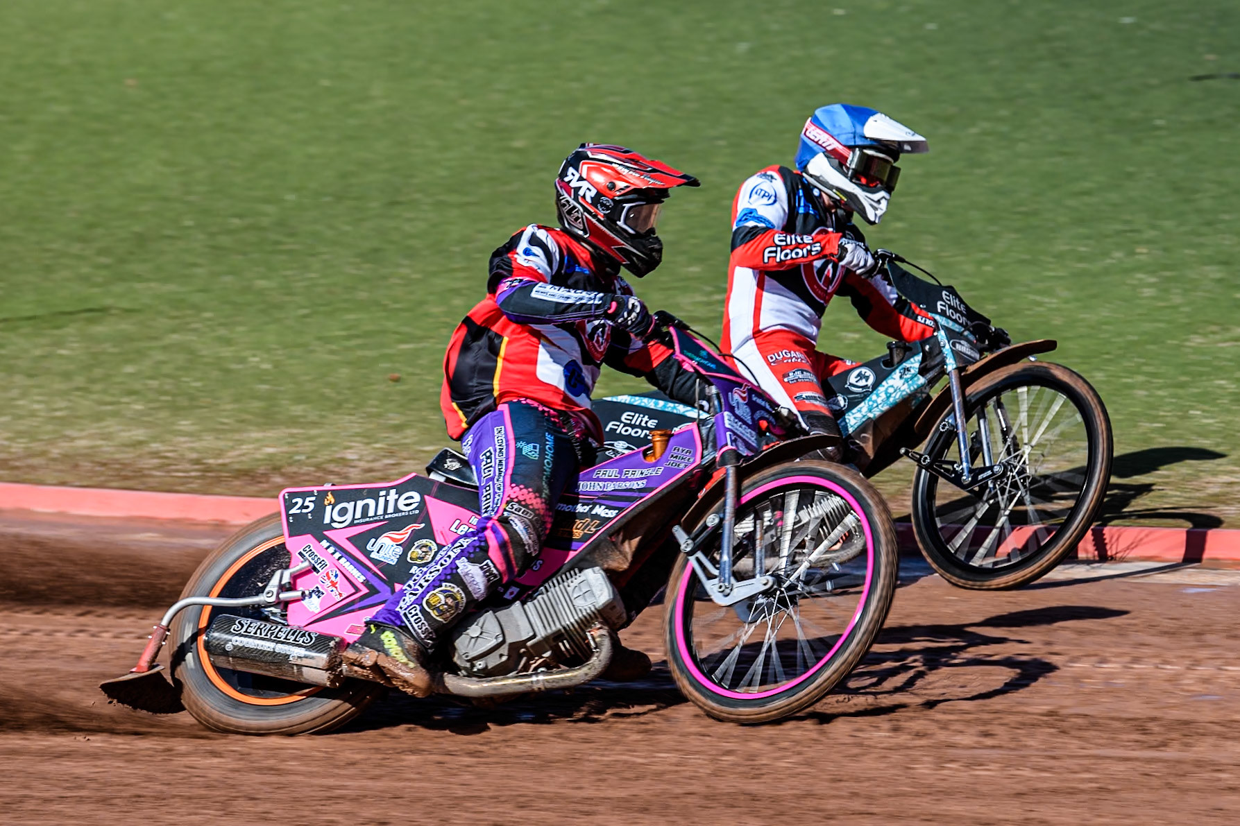 Belle Vue Colts' Ben Trigger  (Red) outside Belle Vue Colts' Chad Wirtzfeld (Blue) during the WSRA National Development League match between Belle Vue Colts and Leicester Lion Cubs at the National Speedway Stadium, Manchester on Friday 29th March 2024. (Photo: Ian Charles | MI News)