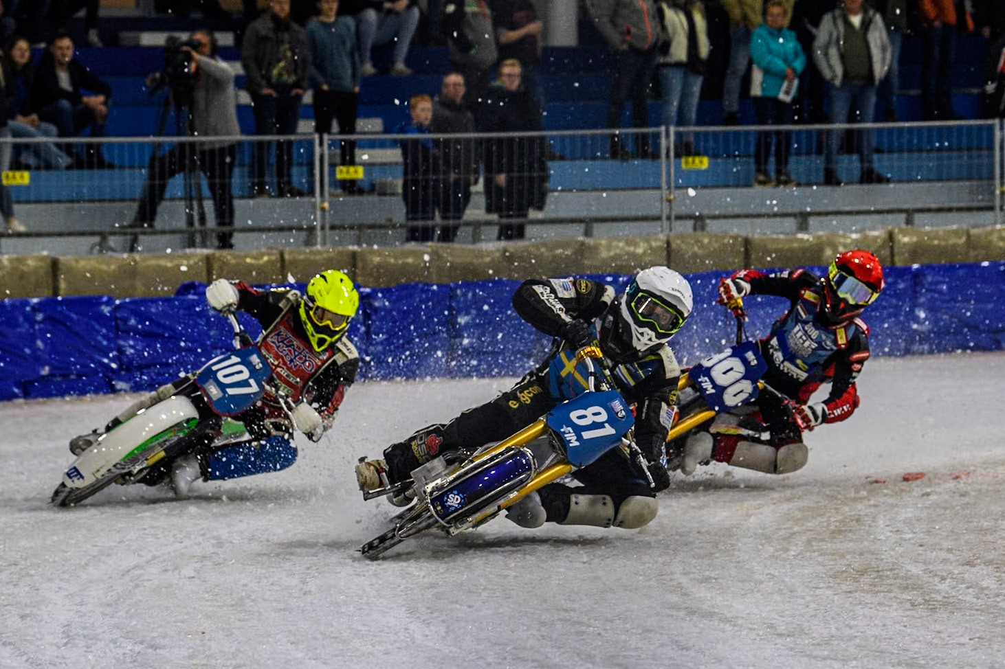 Sweden"s Jimmy Olsén (81) in White leading Czech Republic's Andrej Diviš (107) in Yellow and Netherlands' Jasper Iwema (800) in Red during the FIM Ice Speedway Gladiators World Championship Final 4 at Ice Rink Thialf, Heerenveen on Sunday 7th April 2024. (Photo: Ian Charles | MI News)