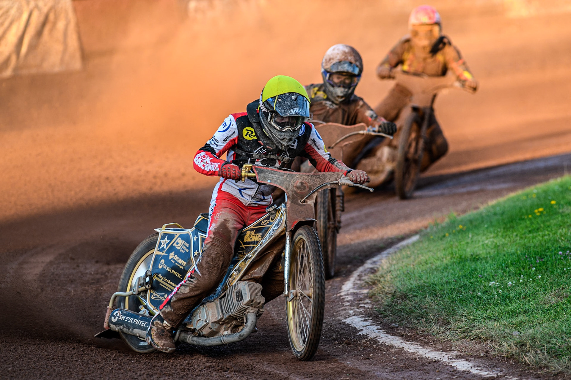 Belle Vue Aces' Norick Blodorn in Yellow leading Belle Vue Aces' Brady Kurtz in White and Birmingham Brummies' Freddie Lindgren in Red during the Rowe Motor Oil Premiership match between Birmingham Brummies and Belle Vue Aces at Perry Bar Stadium, Birmingham on Monday 29th July 2024. (Photo: Ian Charles | MI News)