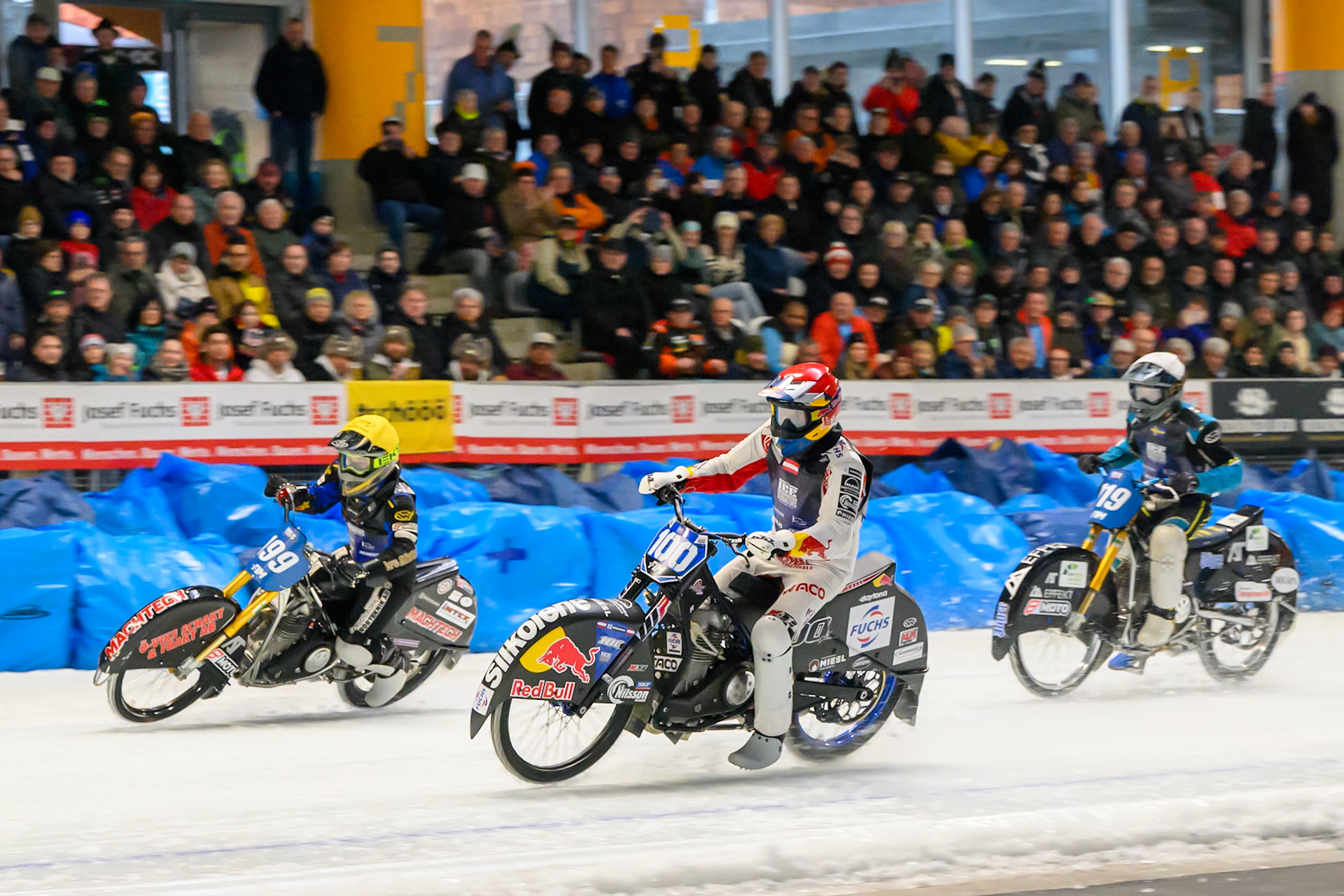 Franz Zorn (100) of Austria in Red rides inside Martin Haarahiltunen (199) of Sweden in Yellow with Filip Jäger (719) of Sweden in White behind during the Ice Speedway Gladiators World Championship Final 2 at Max-Aicher-Arena, Inzell on Sunday 15th March 2026. (Photo: Ian Charles | MI News)