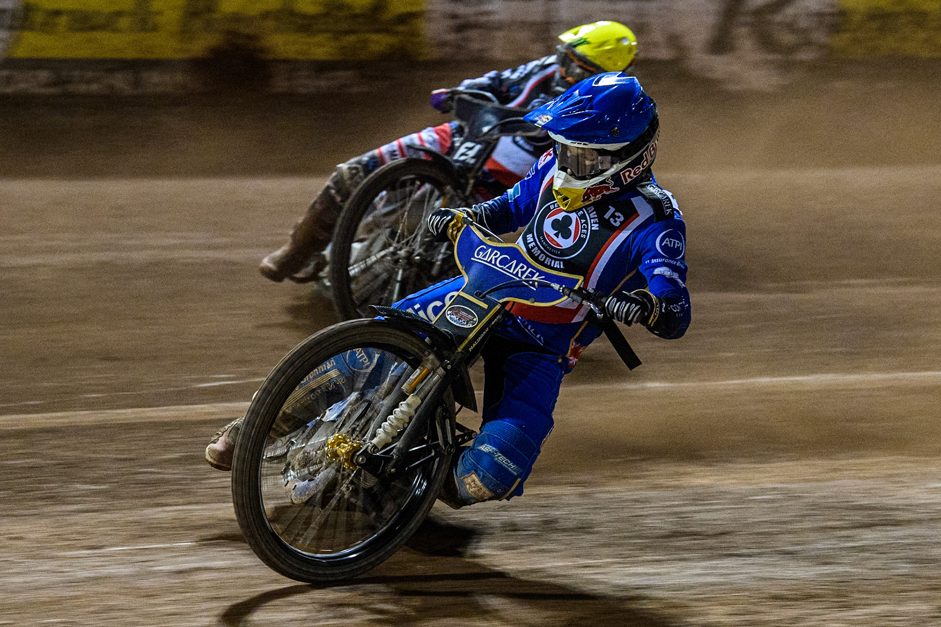 England's Robert Lambert (Blue) inside Sweden’s Fredrik Lindgren (Yellow) during the Peter Craven Memorial Trophy meeting at the National Speedway Stadium, Manchester on Monday 18th March 2024. (Photo: Ian Charles | MI News)