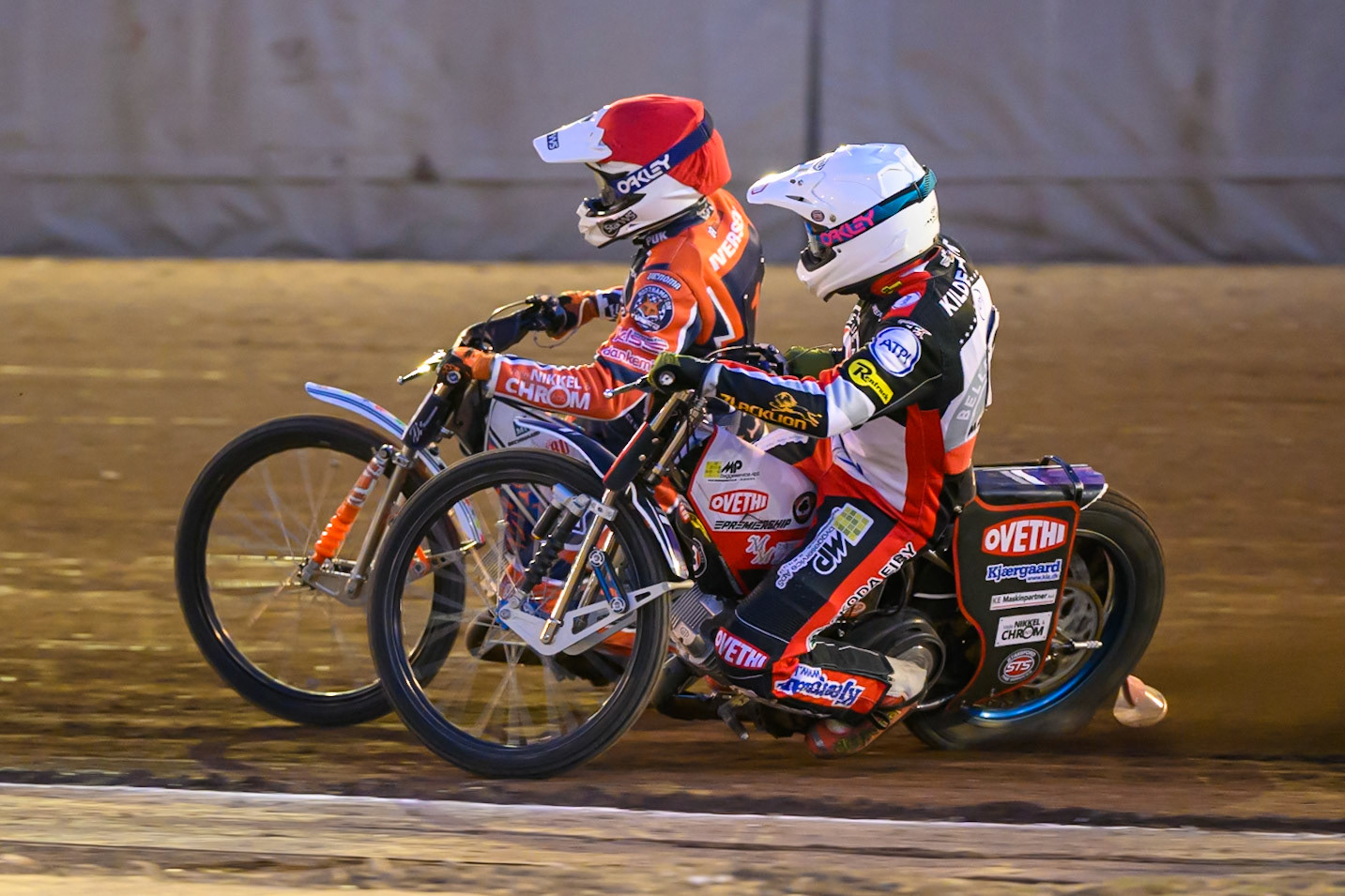 Peter Kildemand of Belle Vue Aces  in White on the inside of Niels-Kristian Iversen of Northampton Foxes  in Red during the Rowe Motor Oil Premiership match between Northampton Foxes and Belle Vue Aces at Northampton International Shaleway, Northampton on Thursday 13th August 2026. (Photo: Ian Charles | MI News)