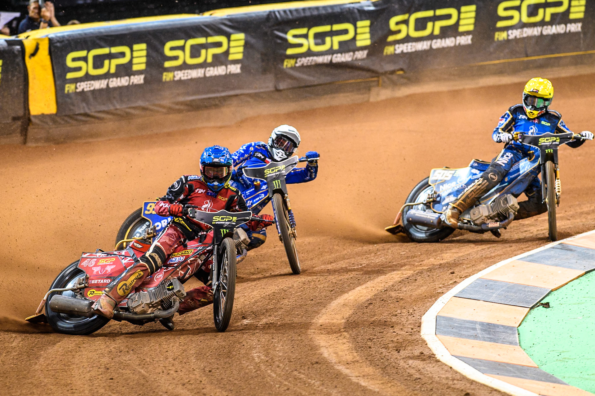 Max Fricke (46) of Australia in Blue leading Bartosz Zmarzlik (95) of Poland  in White and Robert Lambert (505) of Great Britain in Yellow during the FIM Speedway Grand Prix of Great Britain at The Principality Stadium, Cardiff on Saturday 17th August 2024. (Photo: Ian Charles | MI News)