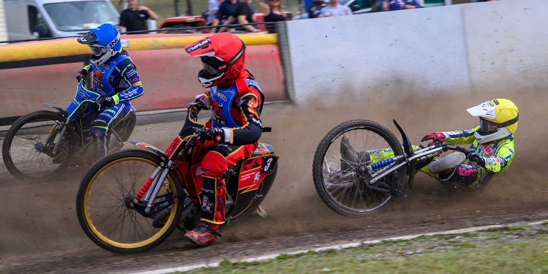 Harry Fletcher of Oxford Chargers in Yellow  falls behind Luke Harris of Buxton Bulls in Red  and Arran Butcher of Buxton Bulls in Blue  during the WSRA National Development League match between Buxton Bulls and Oxford Chargers at Hi-Edge Speedway, Buxton on Sunday 2nd August 2026. (Photo: Ian Charles | MI News)