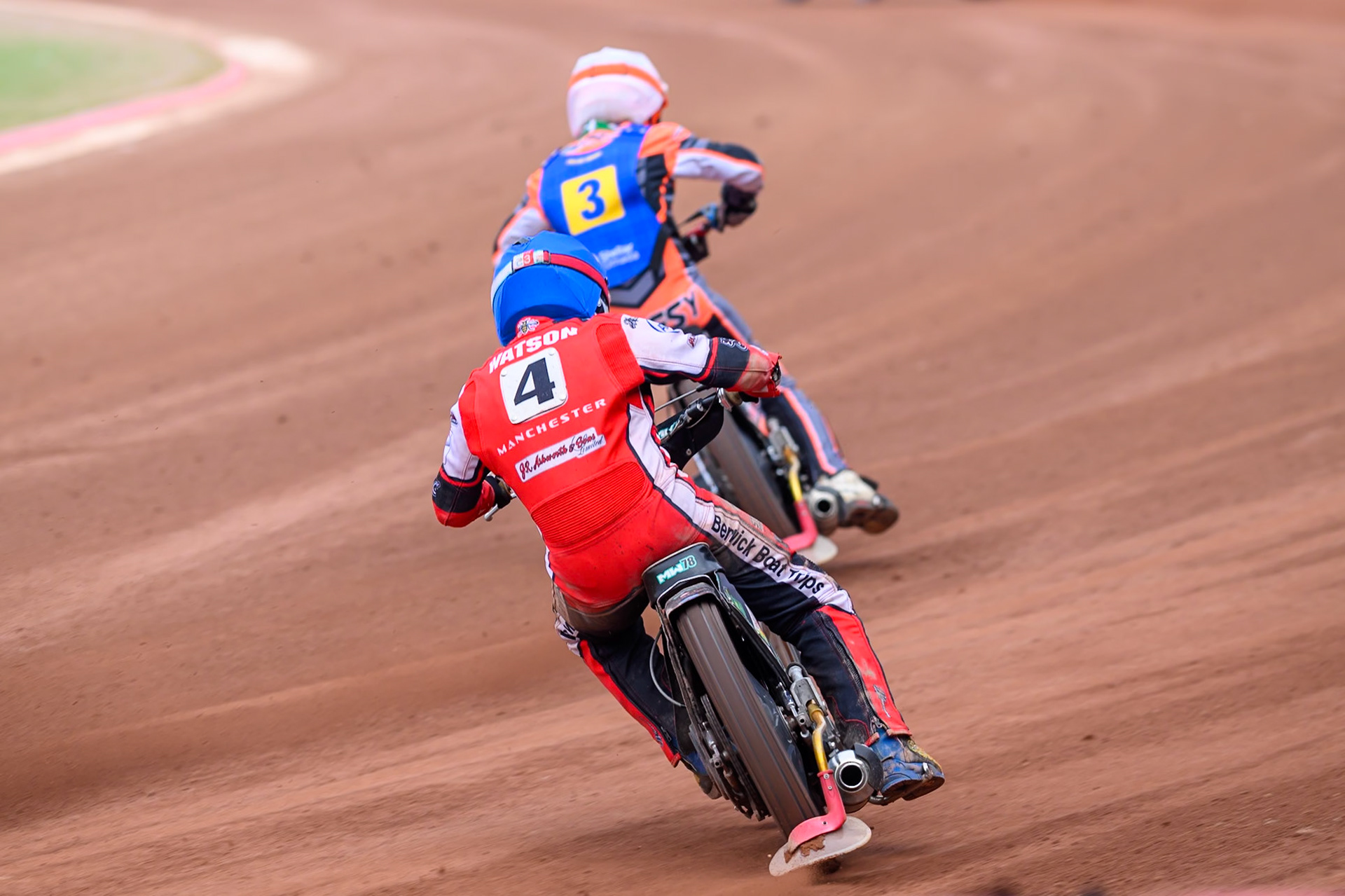 Belle Vue Colts' Mason Watson in Blue chases Monarchs' Connor Coles in White during the WSRA National Development League match between Belle Vue Aces and Edinburgh Academy at the National Speedway Stadium, Manchester on Sunday 12th October 2025. (Photo: Ian Charles | MI News)