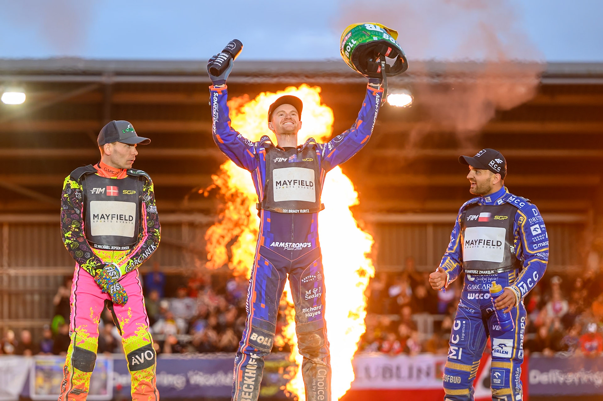 Brady Kurtz (101) of Australia (Centre) celebrates his win in the Final with Michael Jepsen Jensen (52) of Denmark (Left) and Bartosz Zmarzlik (95) of Poland (Right) during the ATPI  FIM Speedway GP of Manchester at the National Speedway Stadium, Manchester on Saturday 6th June 2026. (Photo: Ian Charles | MI News)