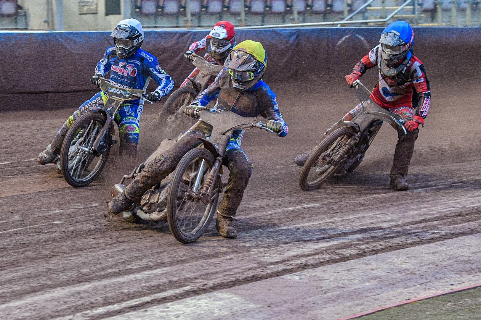 Oxford Chargers' Senna Summers  in Yellow and Oxford Chargers' Ashton Vale  in White leading Belle Vue Colts' Jack Shimelt  in Red and Belle Vue Colts' Harry McGurk  in Blue during the WSRA National Development League match between Belle Vue Colts and Oxford Chargers at the National Speedway Stadium, Manchester on Friday 2nd August 2024. (Photo: Ian Charles | MI News)