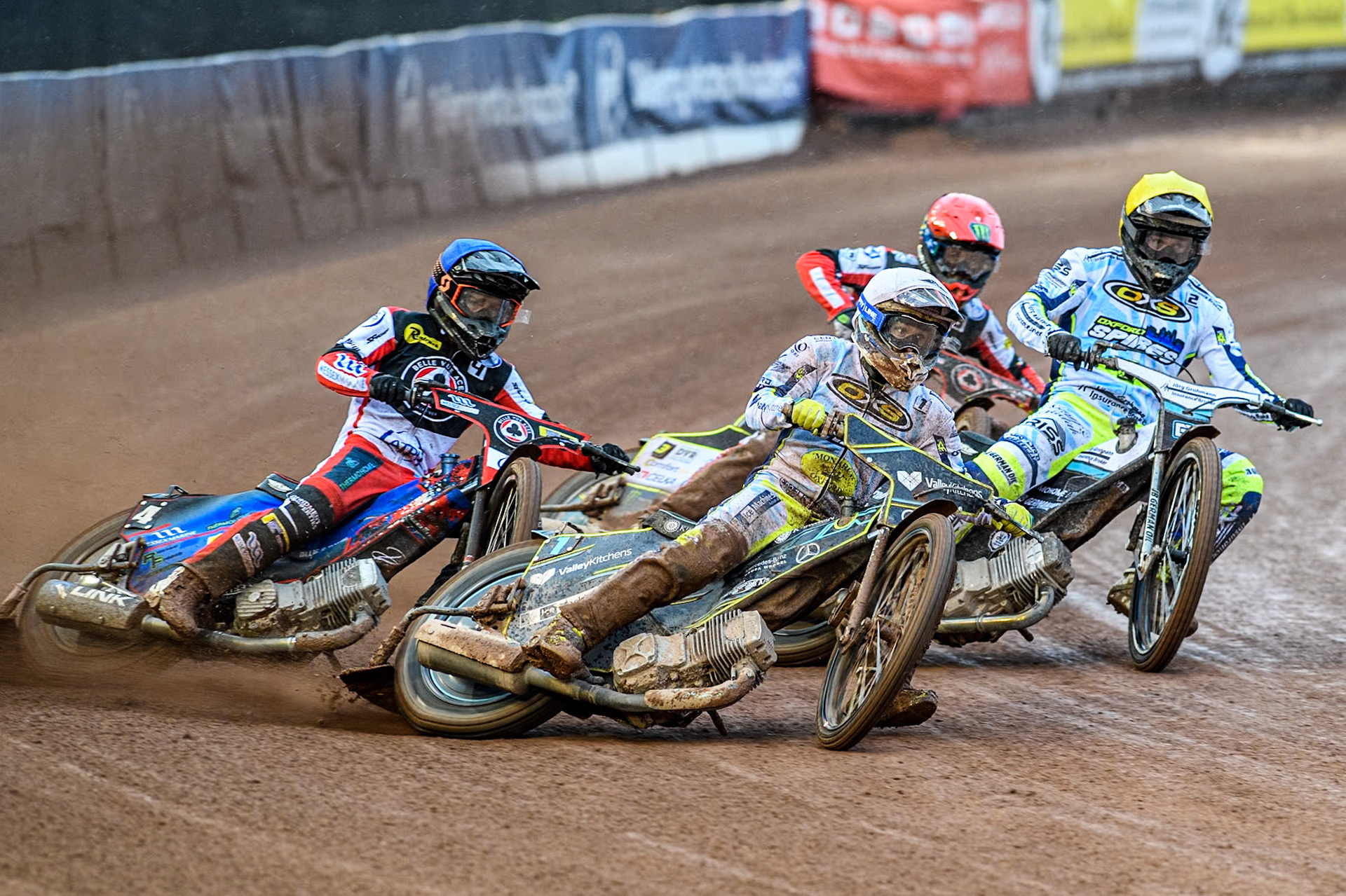 Oxford Spires' Rohan Tungate in White leading Belle Vue Aces' Ben Cook, Oxford Spires' Erik Riss in Yellow and Belle Vue Aces' Jaimon Lidsey in Red during the Rowe Motor Oil Premiership match between Belle Vue Aces and Oxford Spires at the National Speedway Stadium, Manchester on Monday 13th May 2024. (Photo: Ian Charles | MI News)