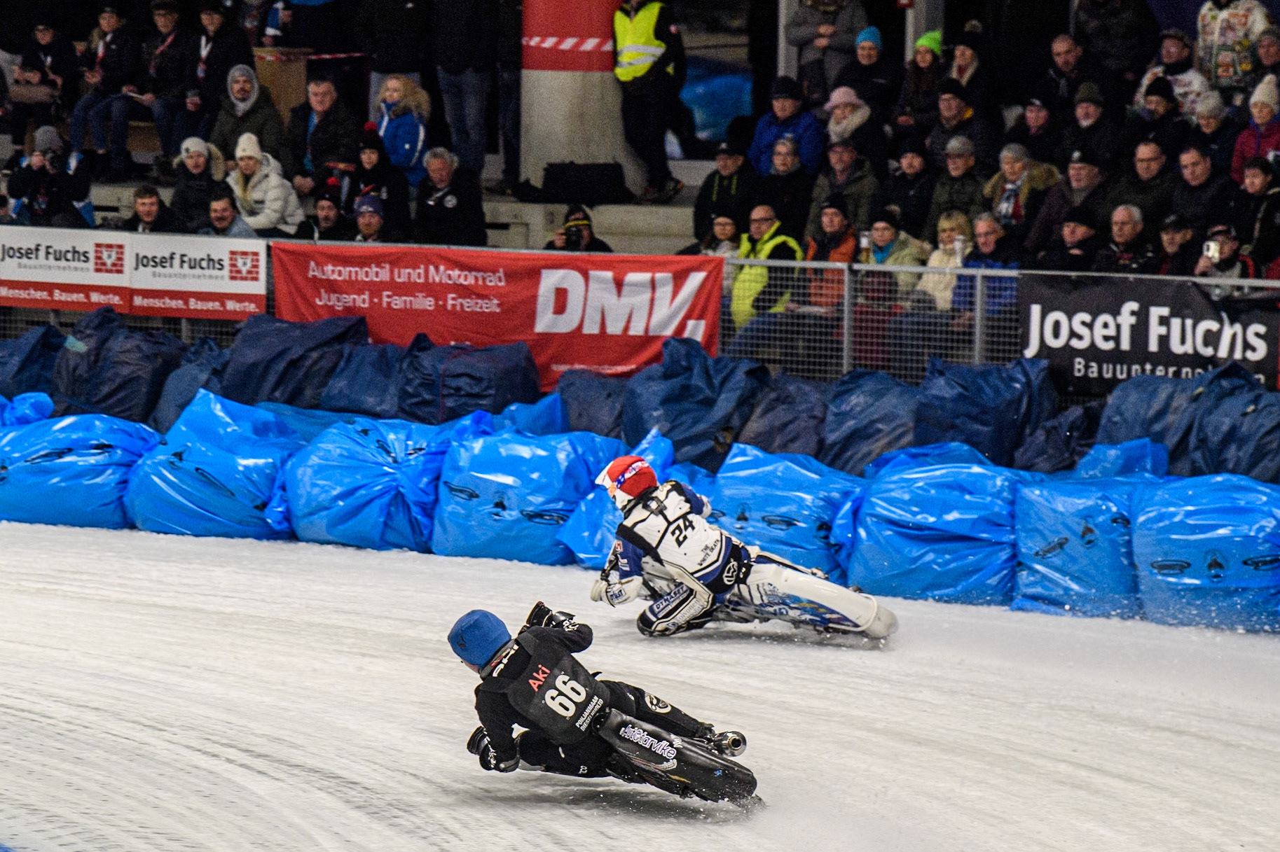 Aki Ala-Riihimäki (66) of Finland in Blue rides inside Max Koivula (24) of Finland in Red during the Ice Speedway Gladiators World Championship Final 1 at Max-Aicher-Arena, Inzell on Saturday 15th March 2025. (Photo: Ian Charles | MI News)