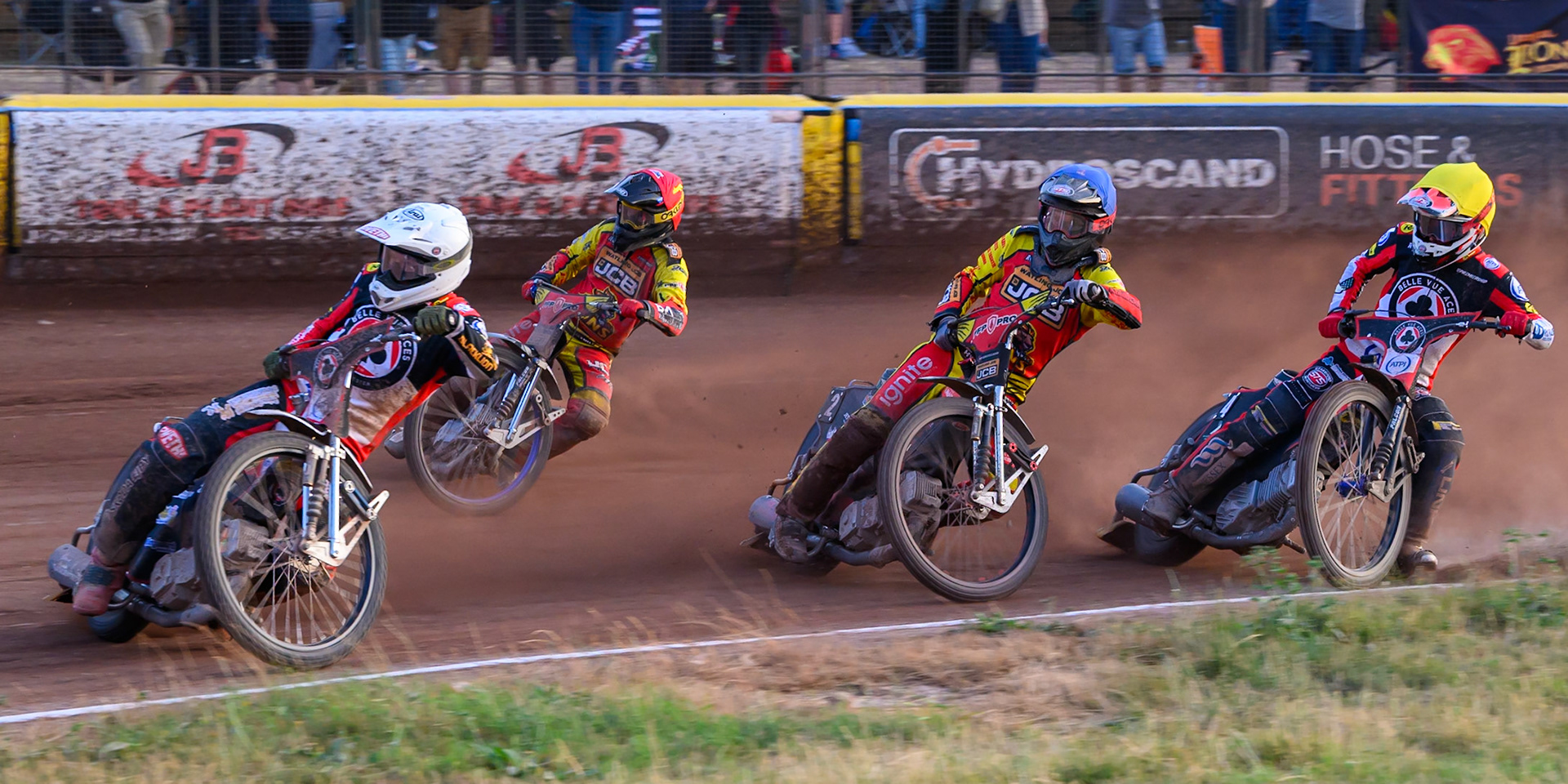 Peter Kildemand of Belle Vue Aces in White leading Ryan Douglas of Leicester Lions in Red Dan Thompson of Leicester Lions  in Blue and Zach Cook of Belle Vue Aces  in Yellow during the Rowe Motor Oil Premiership match between Leicester Lions and Belle Vue Aces at the Hydroscan Arena, Leicester on Thursday 23rd July 2026. (Photo: Ian Charles | MI News)