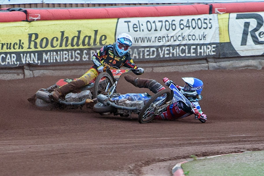 MANCHESTER, UK. JULY 29TH   Harry McGurk (Blue) picks up some drive and falls during the National Development League match between Belle Vue Colts and Leicester Lion Cubs at the National Speedway Stadium, Manchester on Thursday 29th July 2021. (Credit: Ian Charles | MI News)